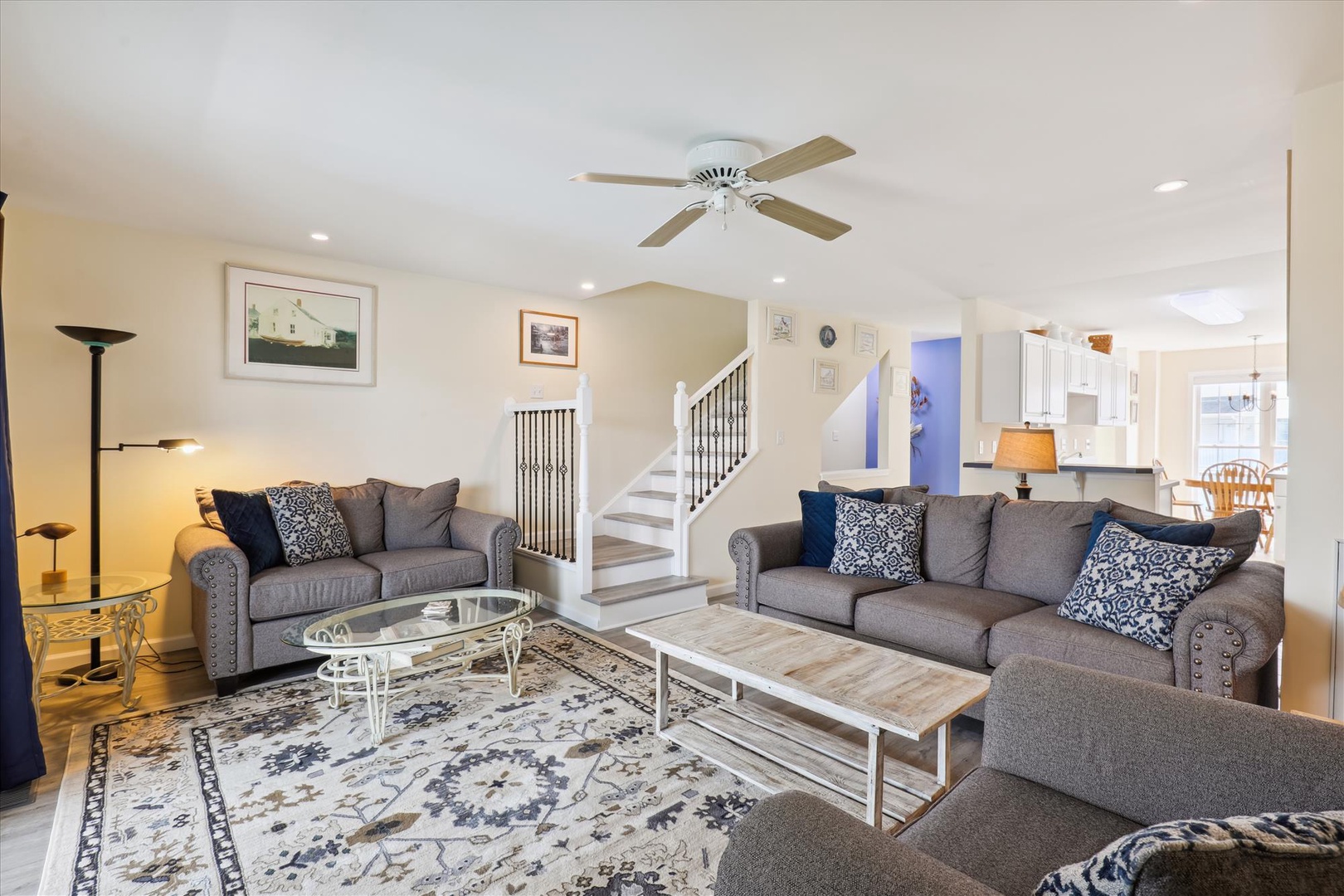 Unwind in your bright, open living room with plush seating and a cozy atmosphere perfect for relaxing after exploring the area.