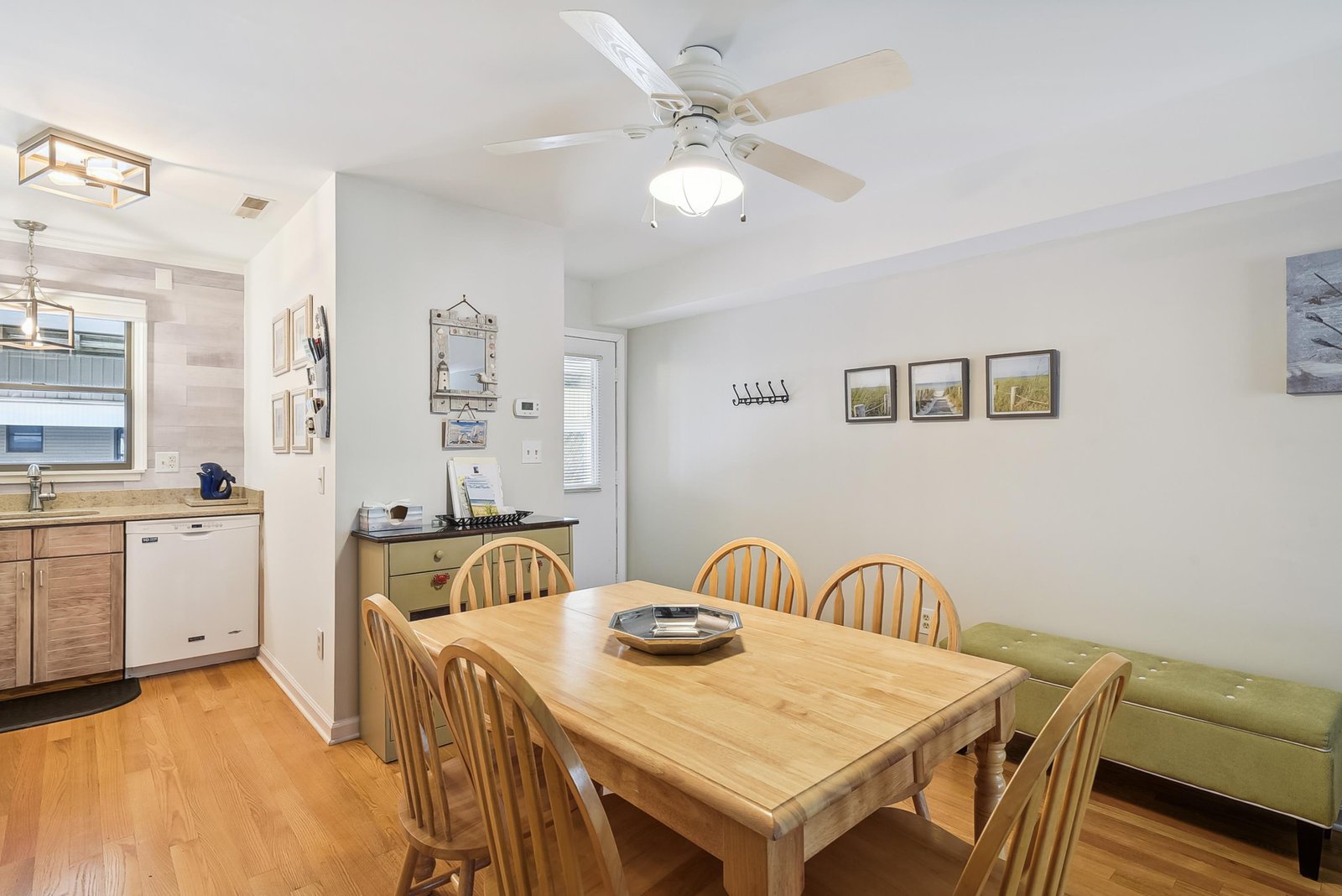 Gather around the warm wood table where stories and meals come together—your cozy dining spot with room for everyone.
