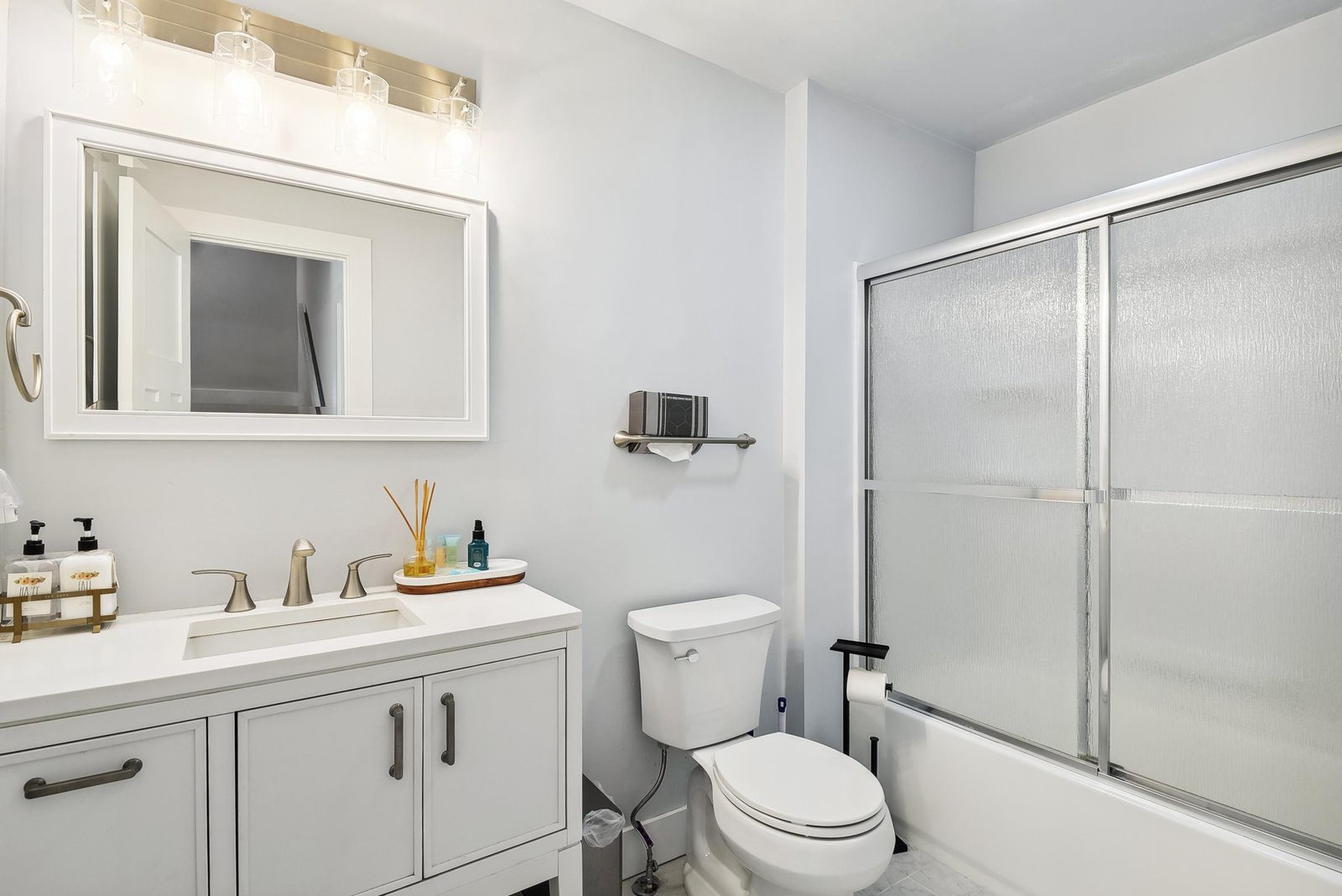 Refresh in your bright, pristine bathroom with a spacious walk-in shower, modern vanity, and thoughtful touches that make your stay feel like home.