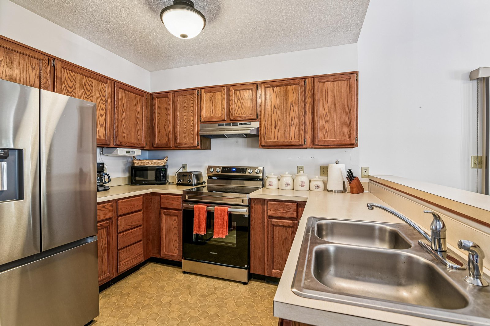 Step into your fully equipped kitchen, where you'll find everything you need to prepare favorite meals. Stainless appliances, ample cabinetry, and generous counter space await your culinary adventures.