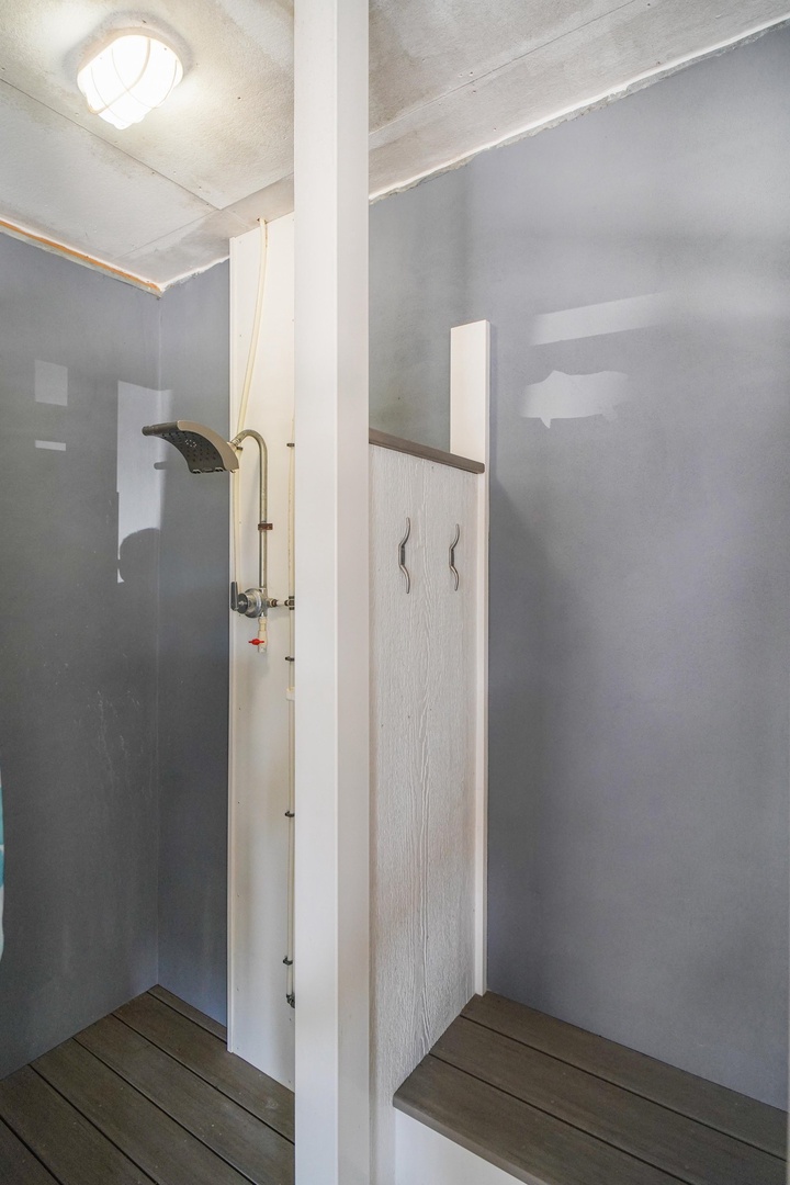Rinse off after a day of exploring in your private outdoor shower, where smooth concrete walls and natural light create a calm, refreshing escape.