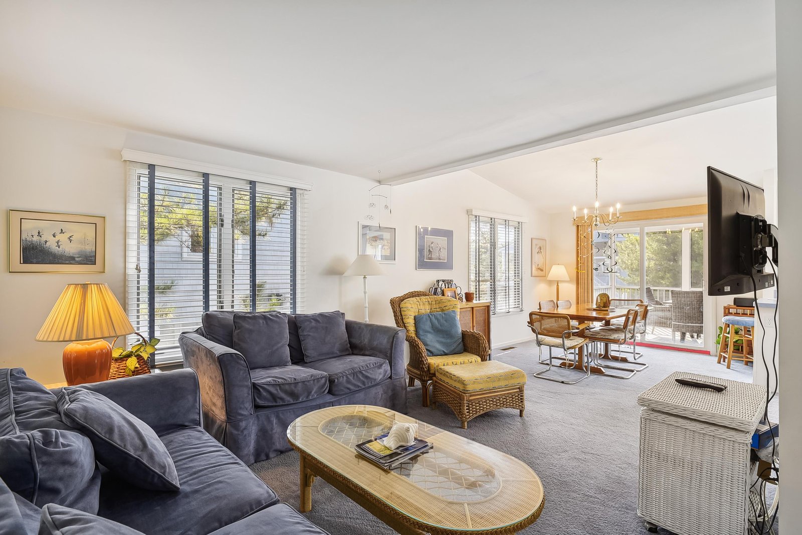 Settle into plush seating and warm natural light in this inviting living space. With a cozy reading nook, dining area steps away, and a private balcony just beyond, you'll find everything you need to unwind.