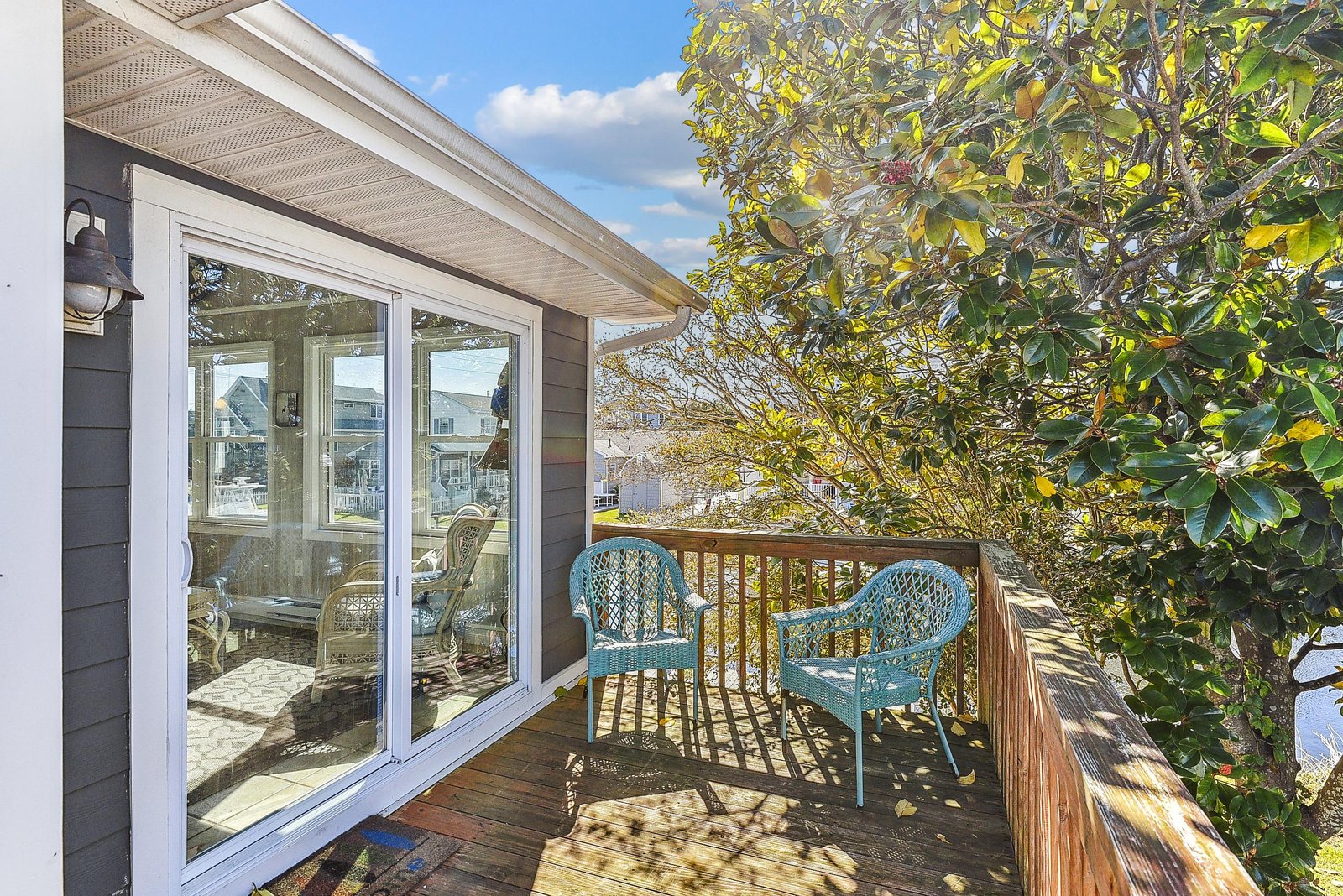Step onto your private balcony with two charming wicker chairs, perfect for savoring morning coffee under dappled sunlight or unwinding as the day gently fades.