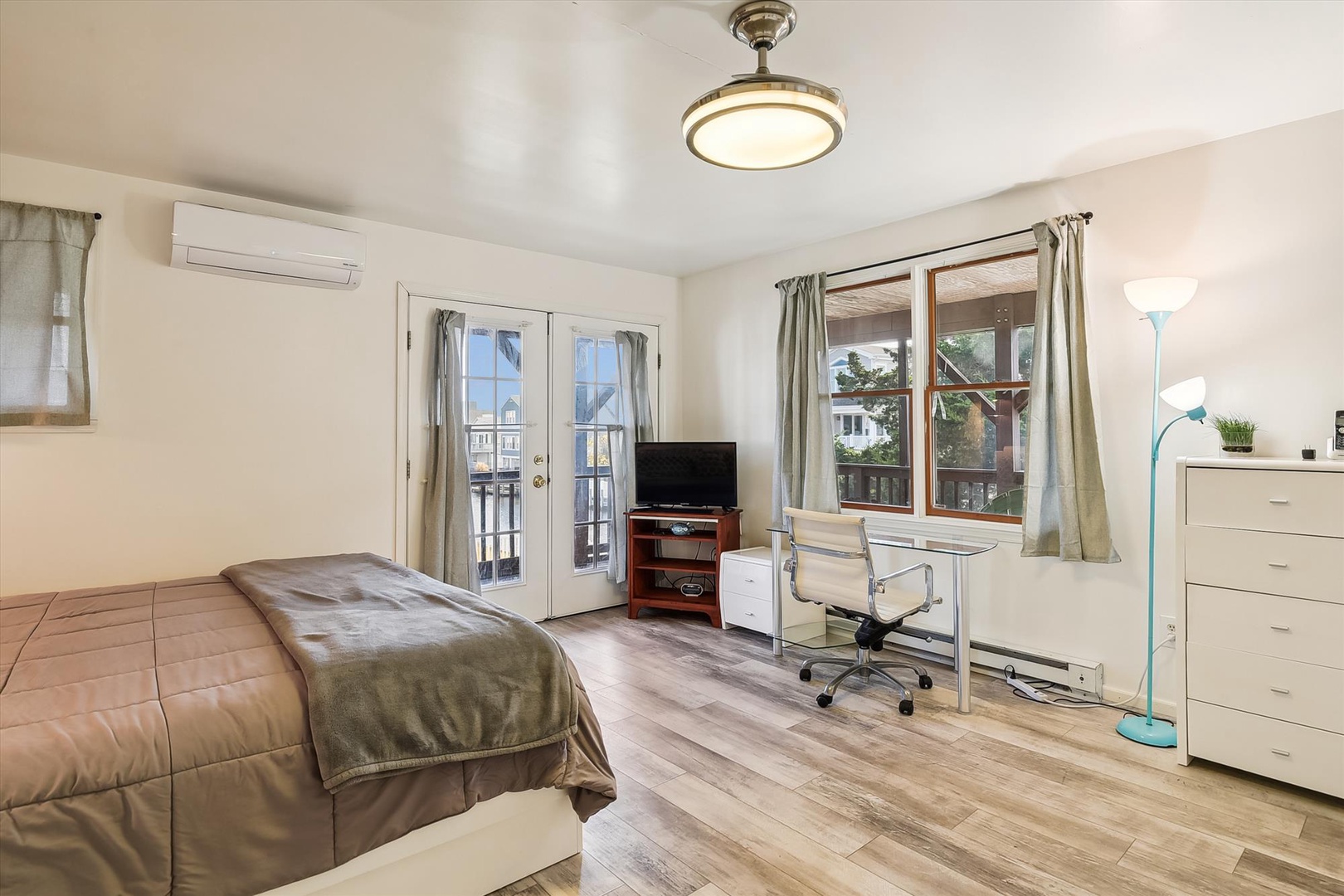Unwind in your spacious bedroom featuring natural light, balcony access, and modern climate control. The flexible workspace and ample storage make this room perfect for both relaxation and productivity.