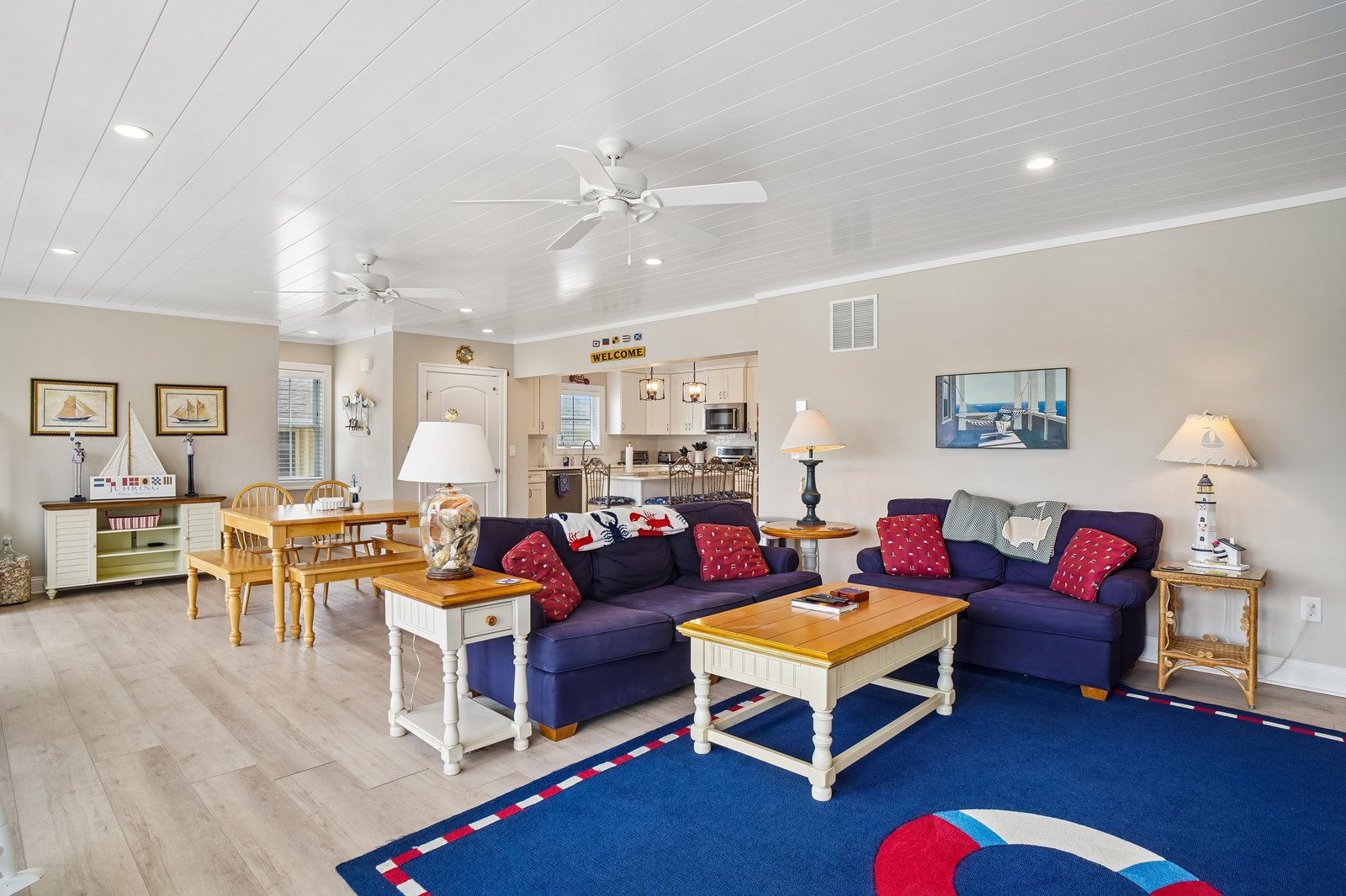 Gather with loved ones in your bright, nautical-themed living area complete with comfy seating, coastal charm, and a warm, welcoming vibe that makes you feel right at home.