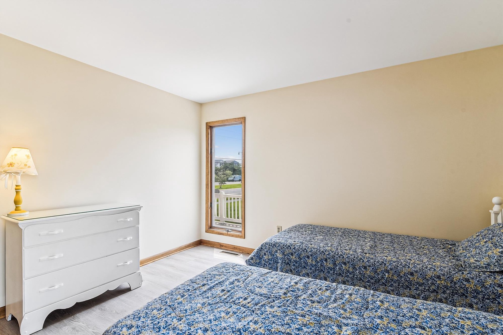 Wake up to peaceful views from your cozy bedroom, where soft natural light and comfortable twin beds set the stage for restful nights and refreshing mornings.