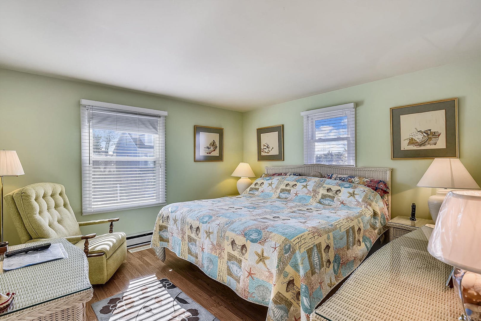 Drift off in your serene coastal bedroom, where soft seaside hues and charming beach-themed touches create a tranquil retreat after a day of exploring.