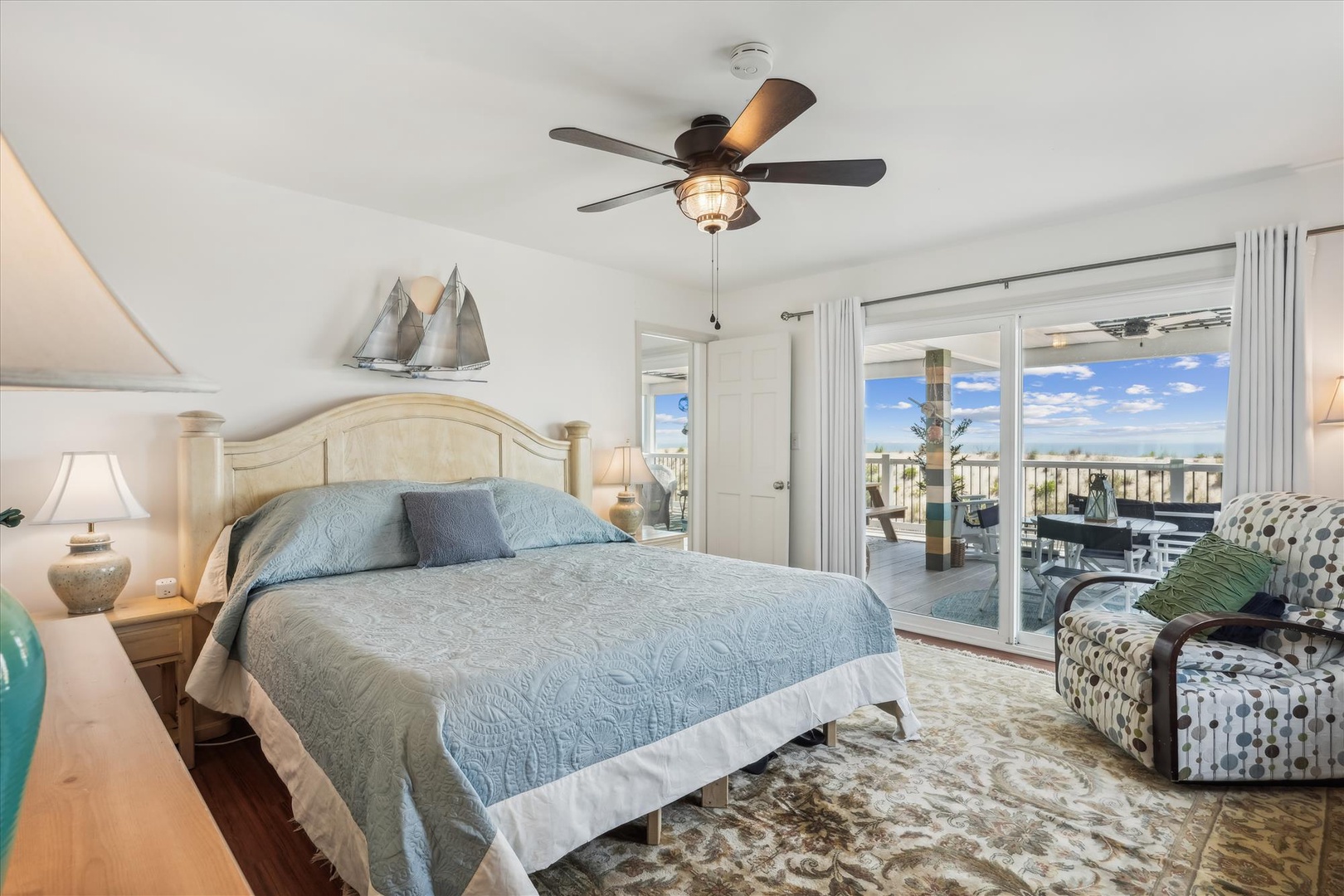 Your coastal-inspired bedroom opens to a private balcony, where soft ocean breezes and endless sky views invite you to unwind in complete tranquility.