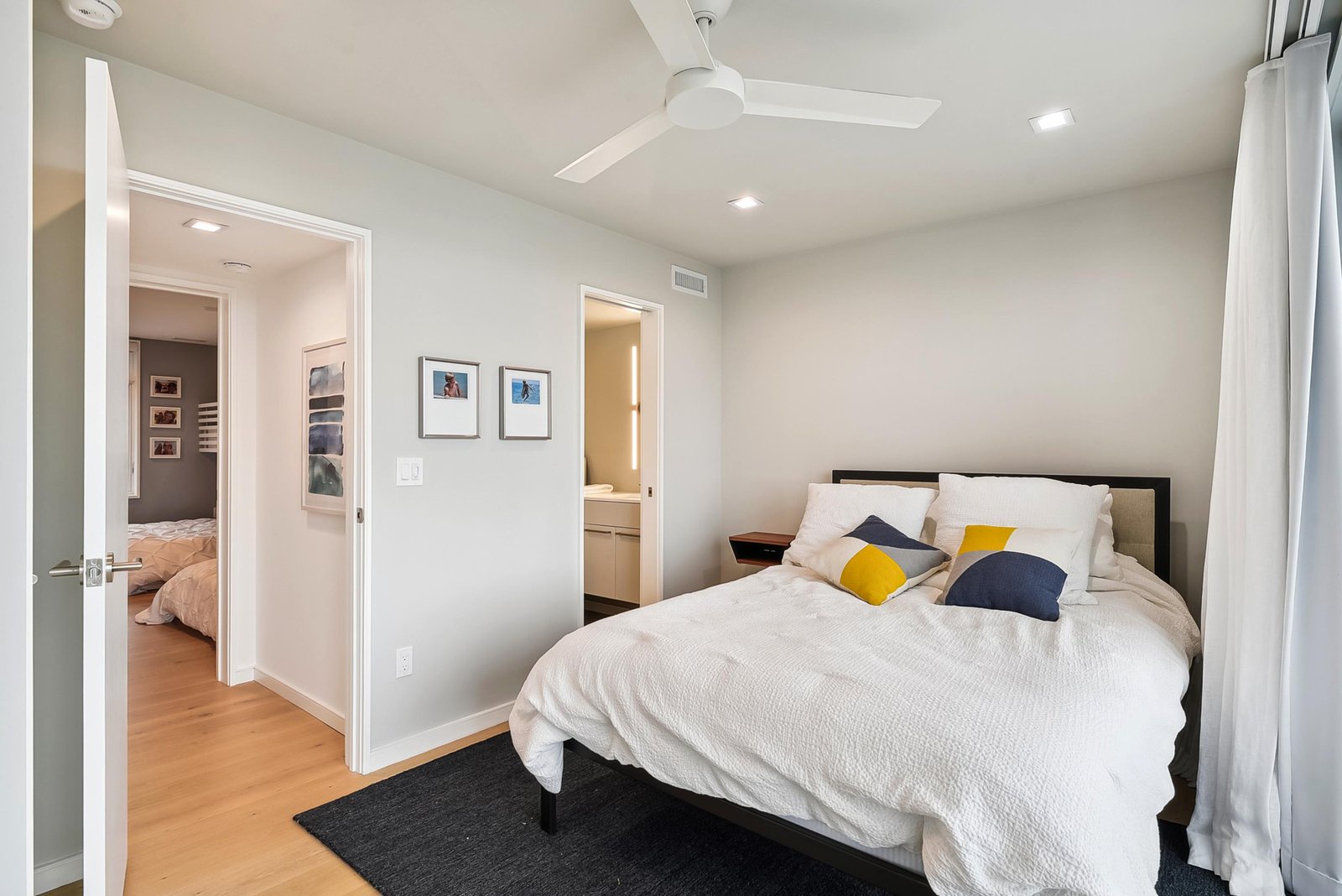 Your peaceful retreat awaits with crisp linens, modern comfort, and soft natural light to help you unwind.