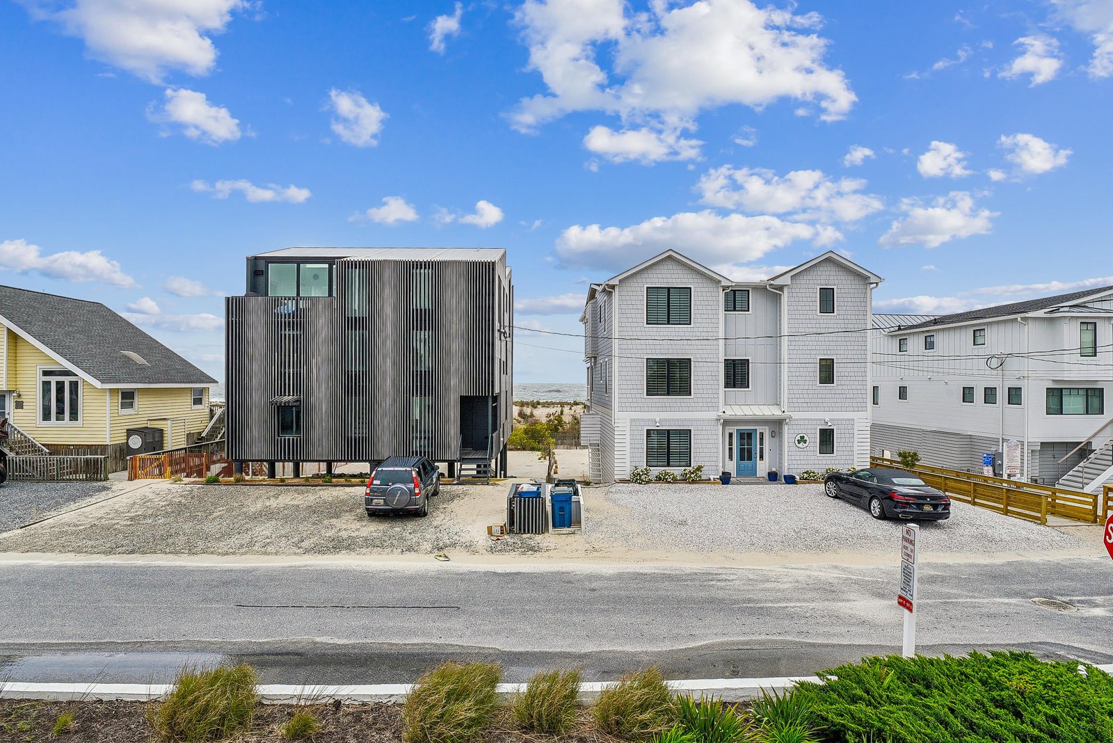 The property sits in a coastal neighborhood with easy access and parking, steps from beachfront living.