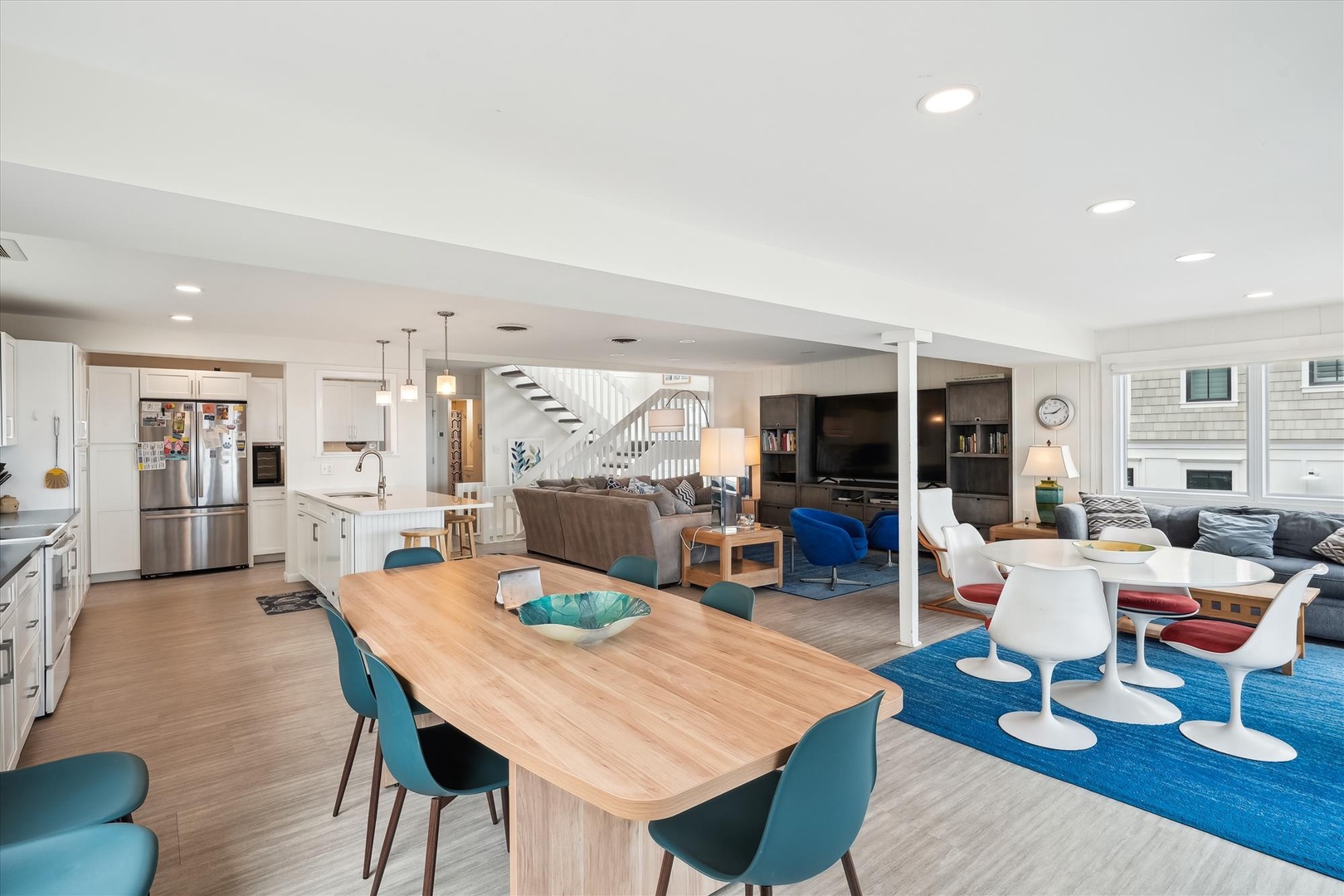 You'll love this stunning open-concept living space where modern design meets coastal comfort. Natural light floods the kitchen, dining, and living areas, creating a warm atmosphere for gathering and making memories together.