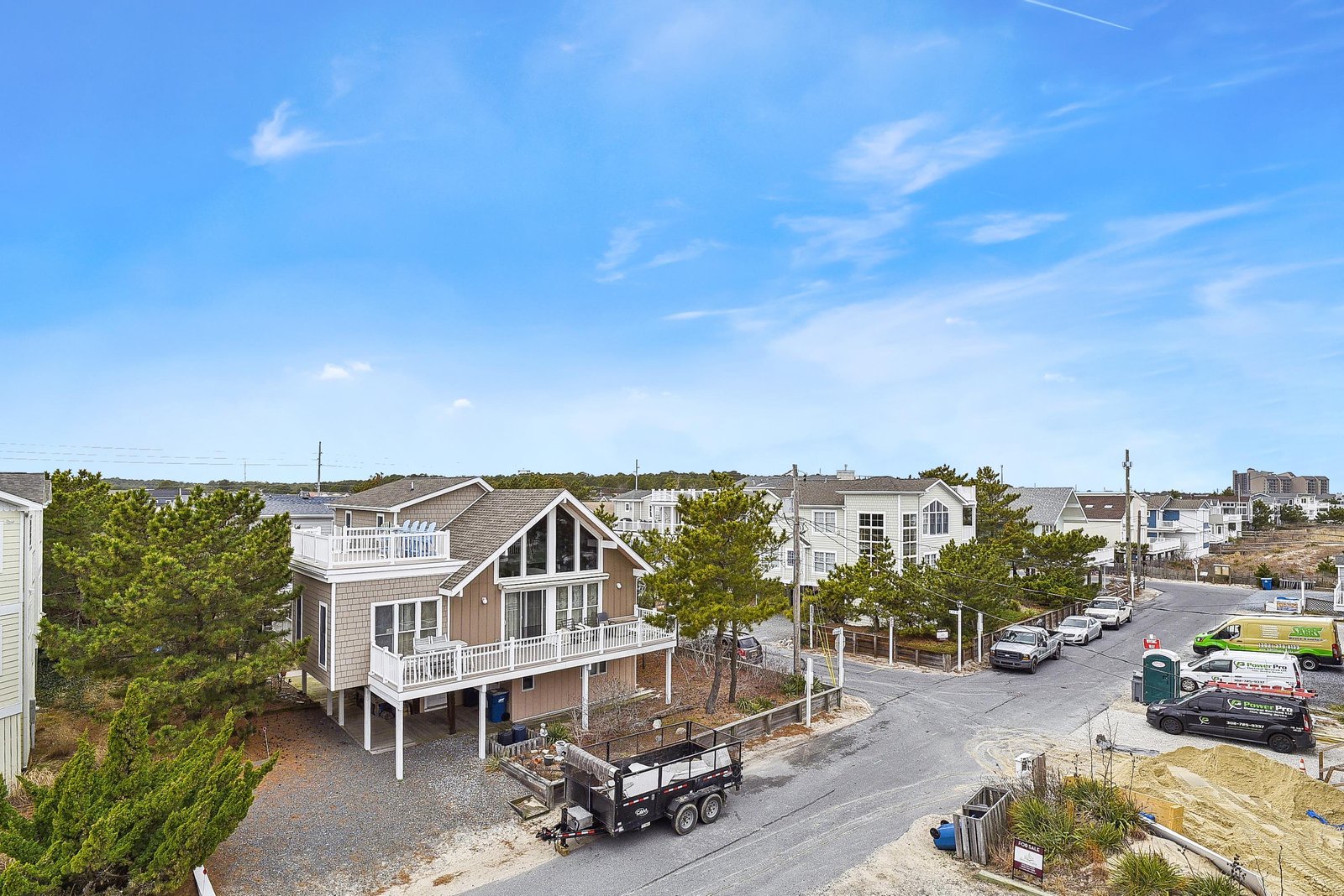 This coastal property sits in a quiet beach community, offering a peaceful neighborhood setting with easy access to the shore.