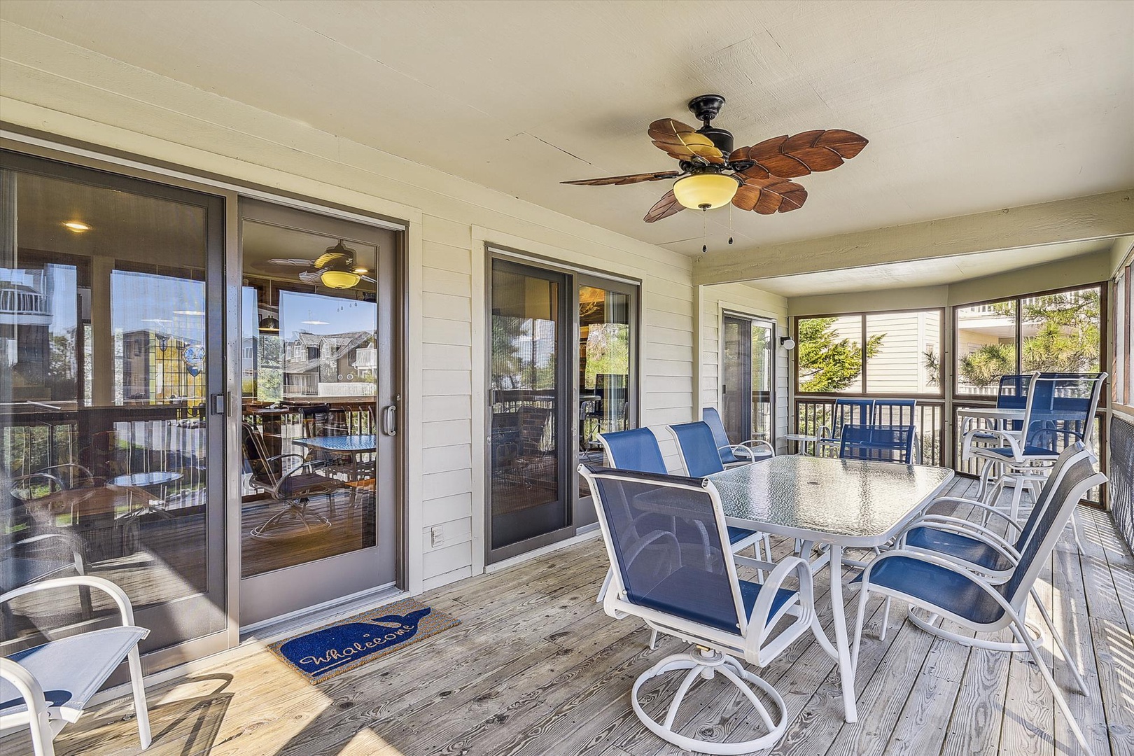 Step onto your private screened porch with coastal breezes and inviting dining space—perfect for morning coffee or evening meals with family.