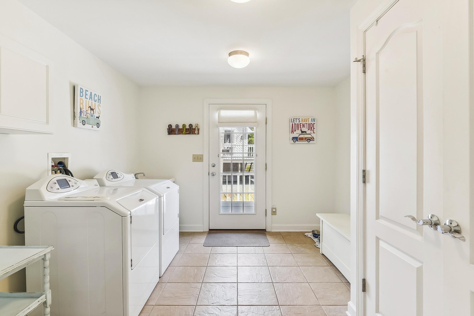A bright, dedicated laundry room with a full-size washer and dryer makes keeping your vacation wardrobe fresh and ready for adventure effortless during your stay.