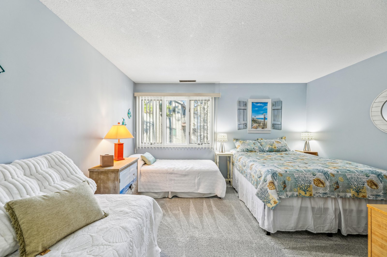 Sink into plush bedding and wake refreshed in your bright, calming bedroom. Two beds and a cozy sofa ensure everyone has their perfect spot to unwind.