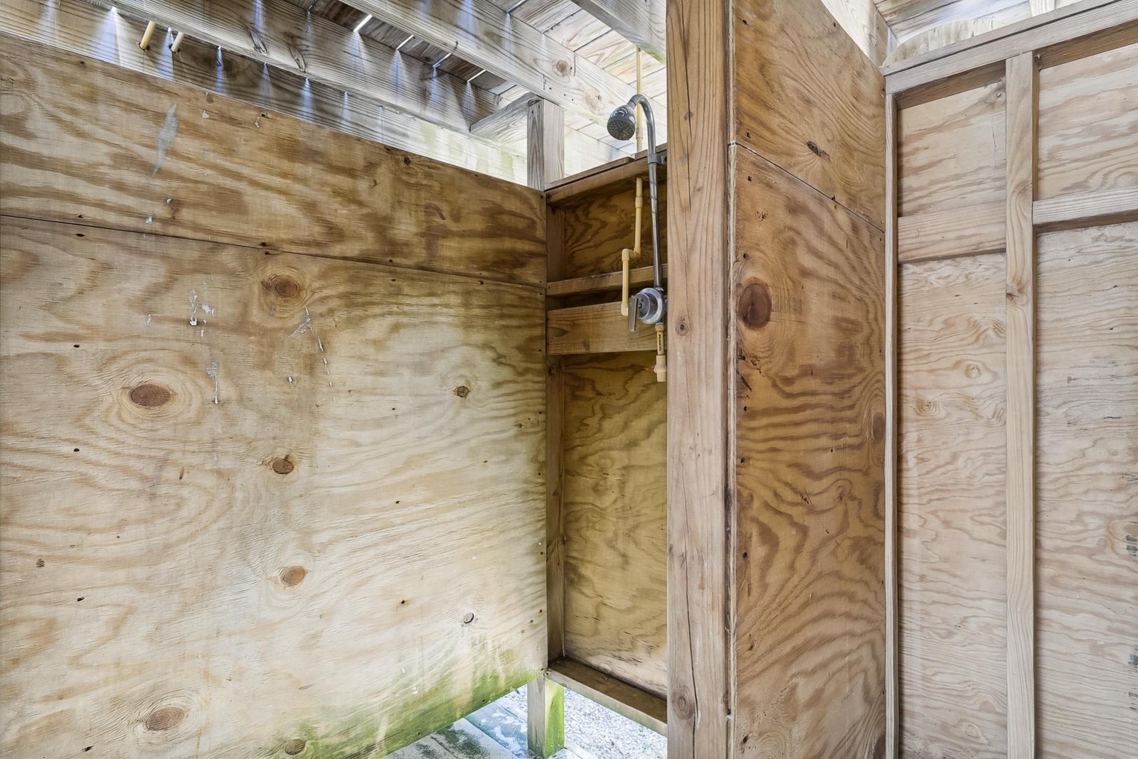 Step into your private outdoor shower, surrounded by warm wood and open to the sky above—a refreshing, nature-inspired escape after a day of adventure.