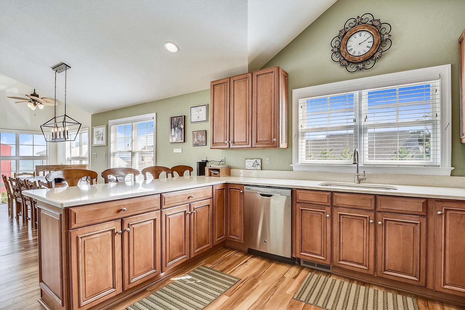 Your spacious kitchen features warm wood cabinets, granite counters, and a breakfast bar perfect for morning coffee or casual dining.