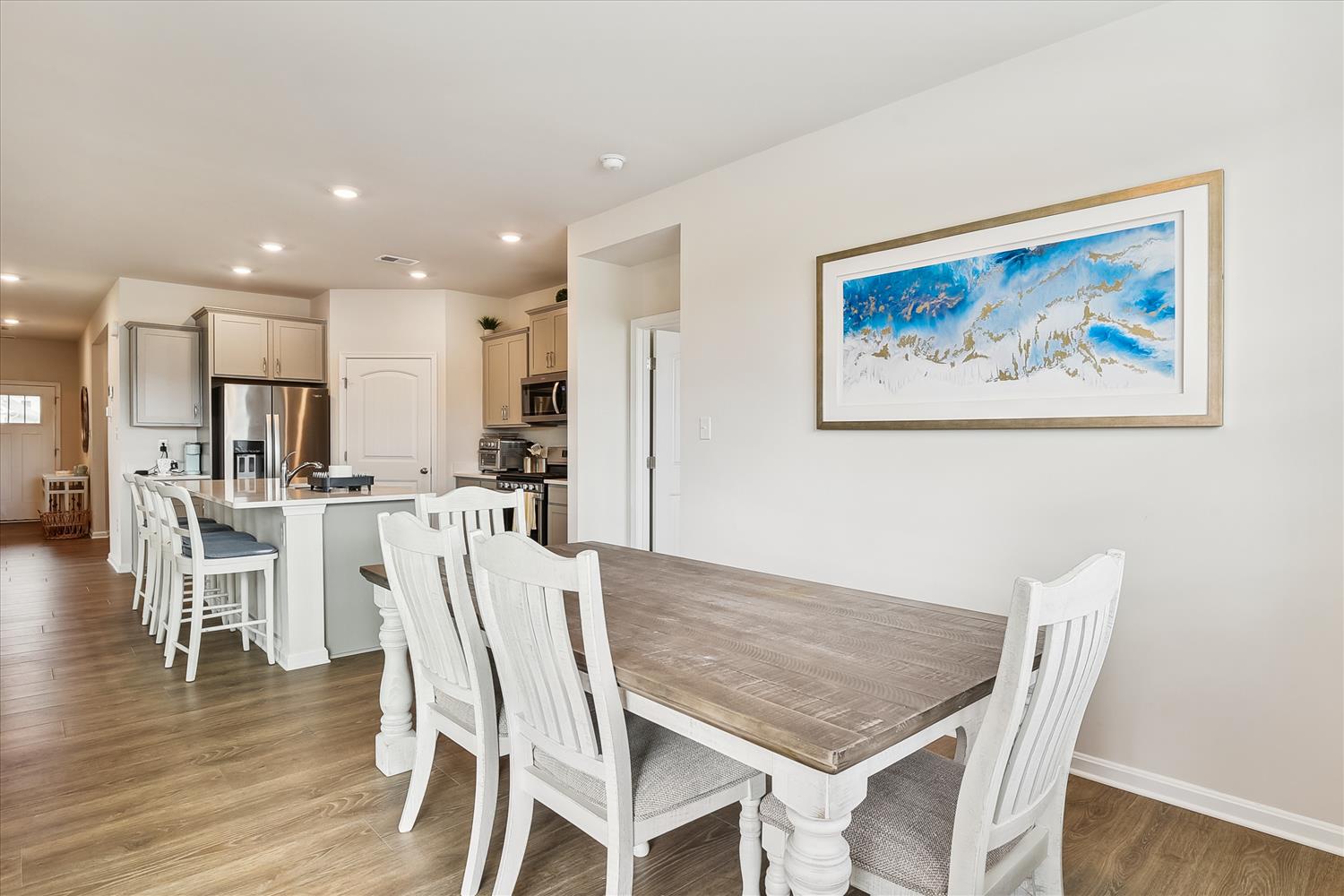 Your open-concept dining and kitchen space flows seamlessly together, perfect for gathering with family and friends over home-cooked meals.