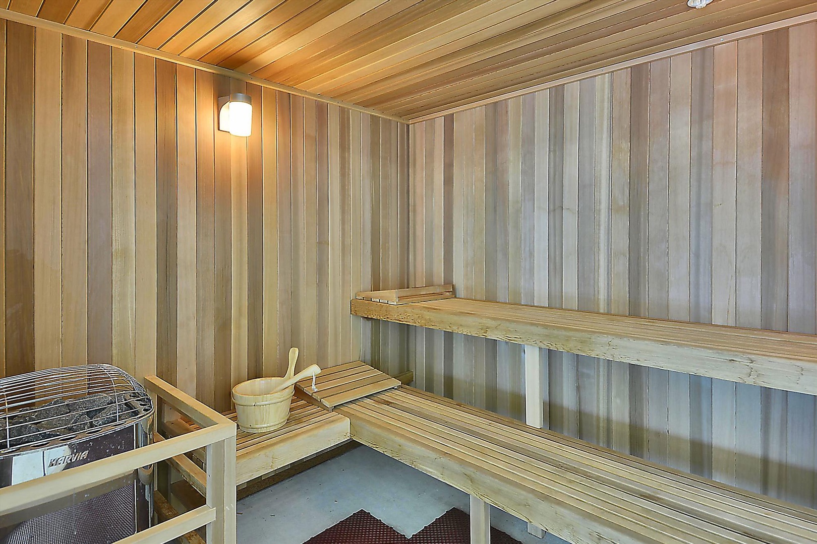 Warm wood-lined sauna with tiered benches invites you to unwind and detoxify in a tranquil, heat-filled escape after a busy day of exploring.