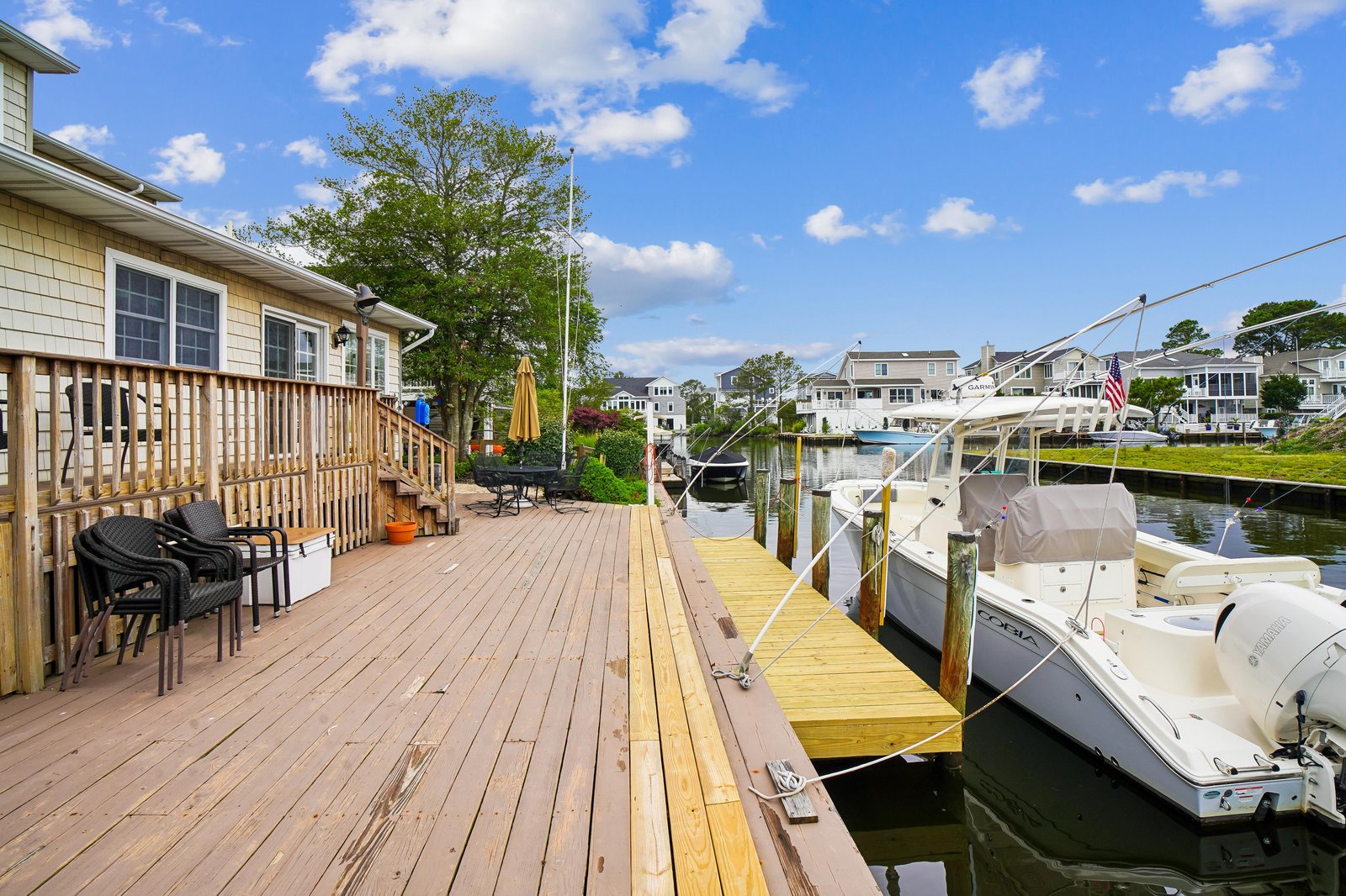 Spacious waterfront deck with private dock access where you can enjoy morning coffee or evening BBQ by the water. Your boat awaits for sunny days exploring the bay.
