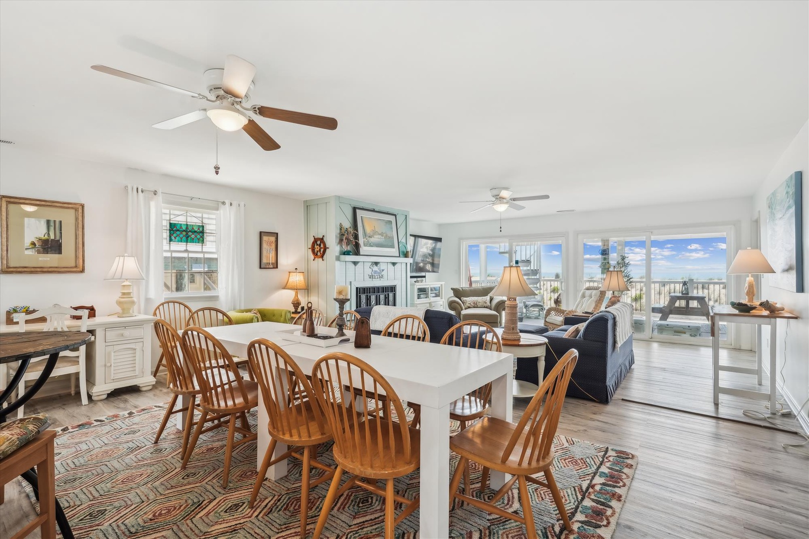 Your coastal retreat awaits with bright, open living and dining spaces where you'll gather for meals and relaxation. Natural light pours through generous windows, revealing serene water views that frame your peaceful escape.