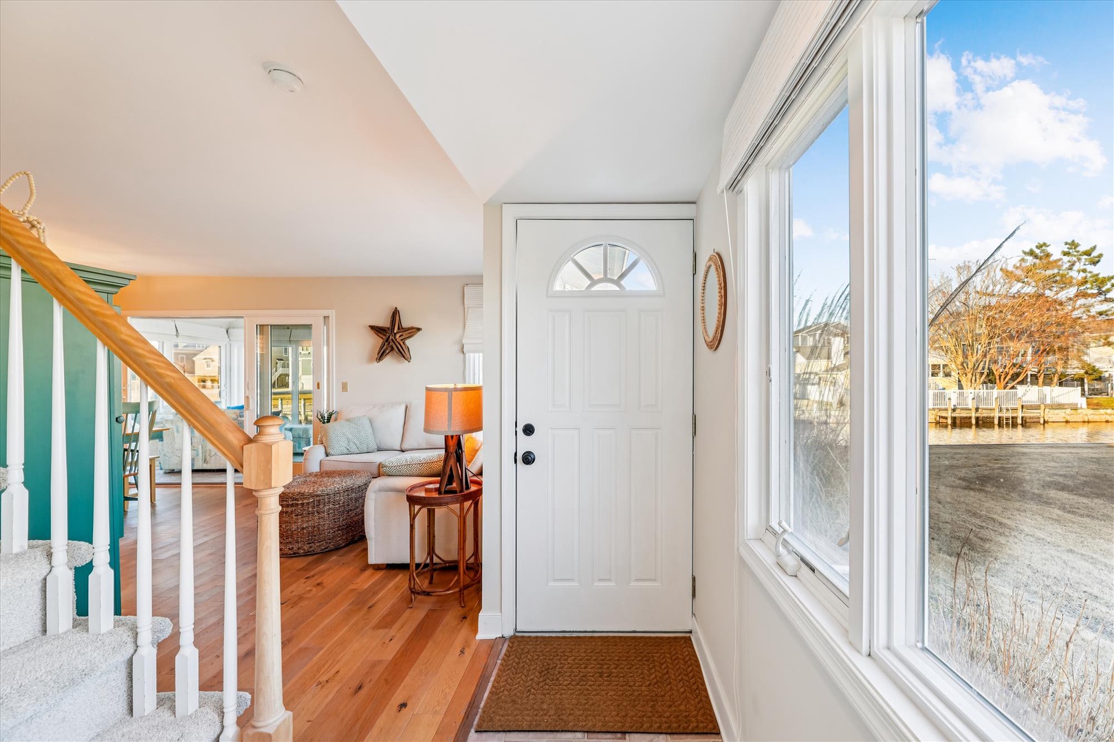 Step into your bright waterfront haven where coastal charm meets comfort, with stunning water views greeting you at the door.