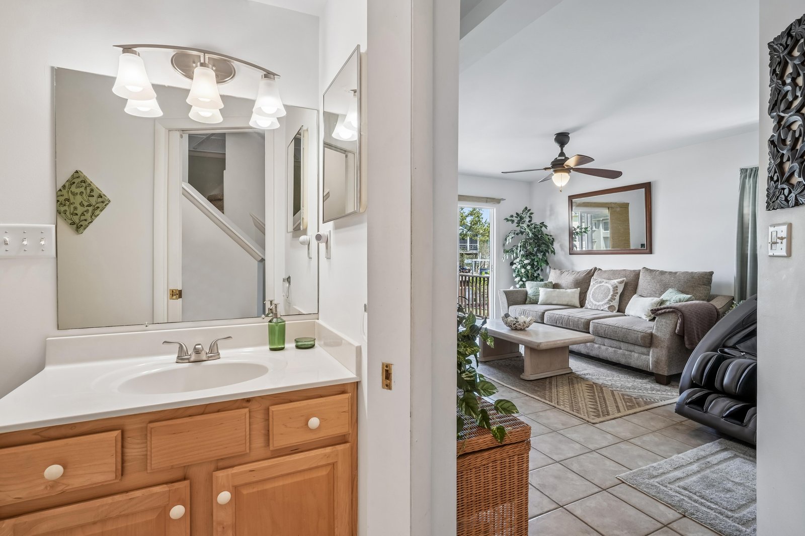 Refresh yourself in the bright, spotless bathroom, then unwind in the spacious living room with plush seating and calming décor. Natural light and greenery create a peaceful retreat after your adventures.