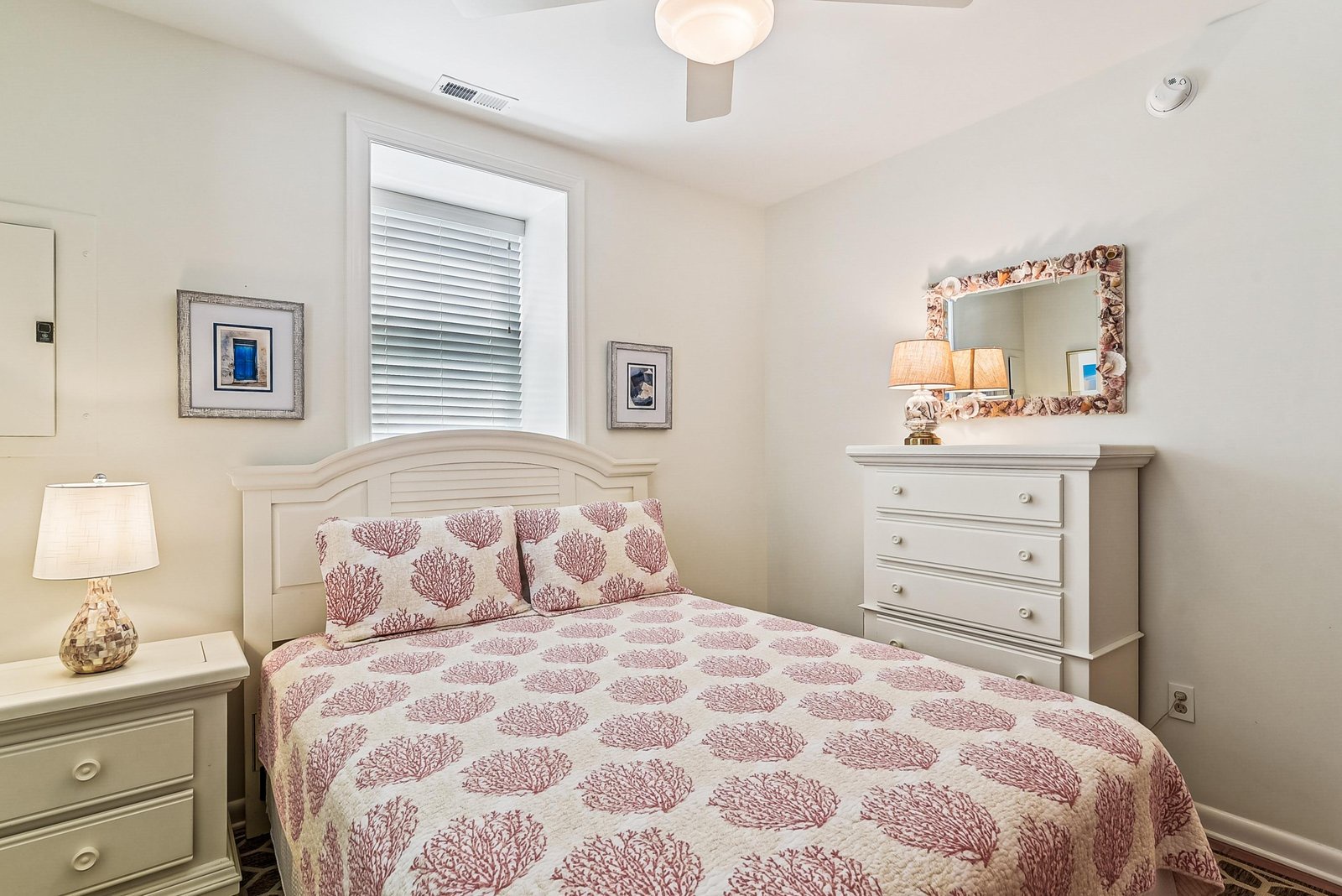 Soft coastal tones and thoughtful touches create a serene retreat where you can unwind after a day of exploring. This cozy bedroom invites restful nights and peaceful mornings.