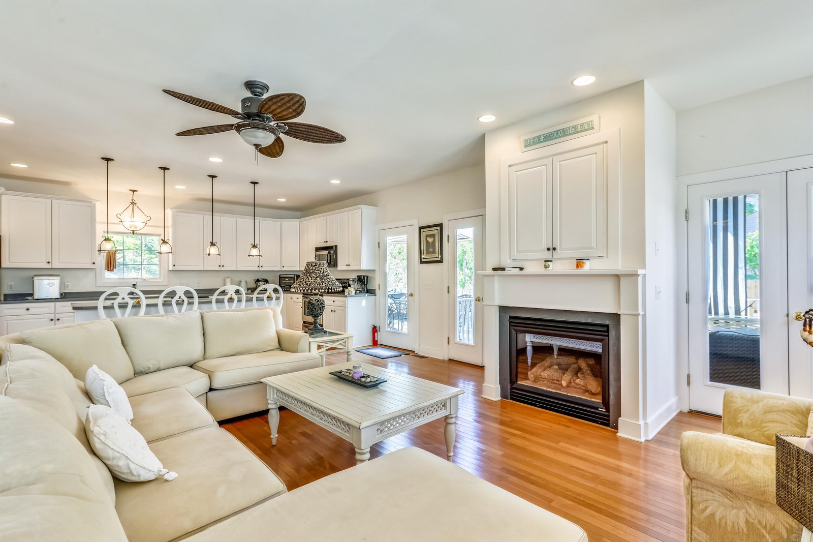 Settle into your bright, inviting living space where gleaming hardwood floors and a cozy fireplace create the perfect retreat after exploring local attractions.