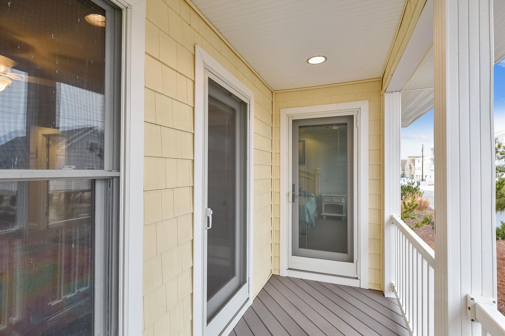 Step onto your covered balcony with sunny views of the neighborhood—perfect for morning coffee or sunset moments with the coastal breeze in the air.
