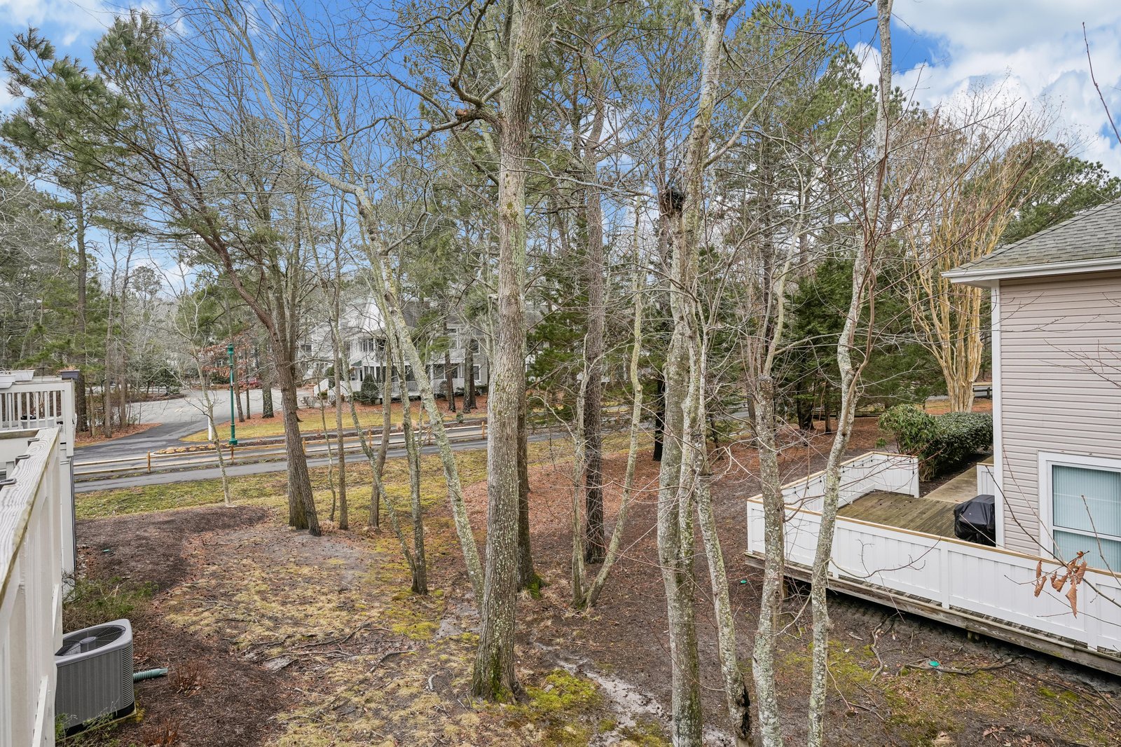 Peaceful residential neighborhood surrounds the property, nestled among mature trees and quiet streets—a serene setting for your getaway.