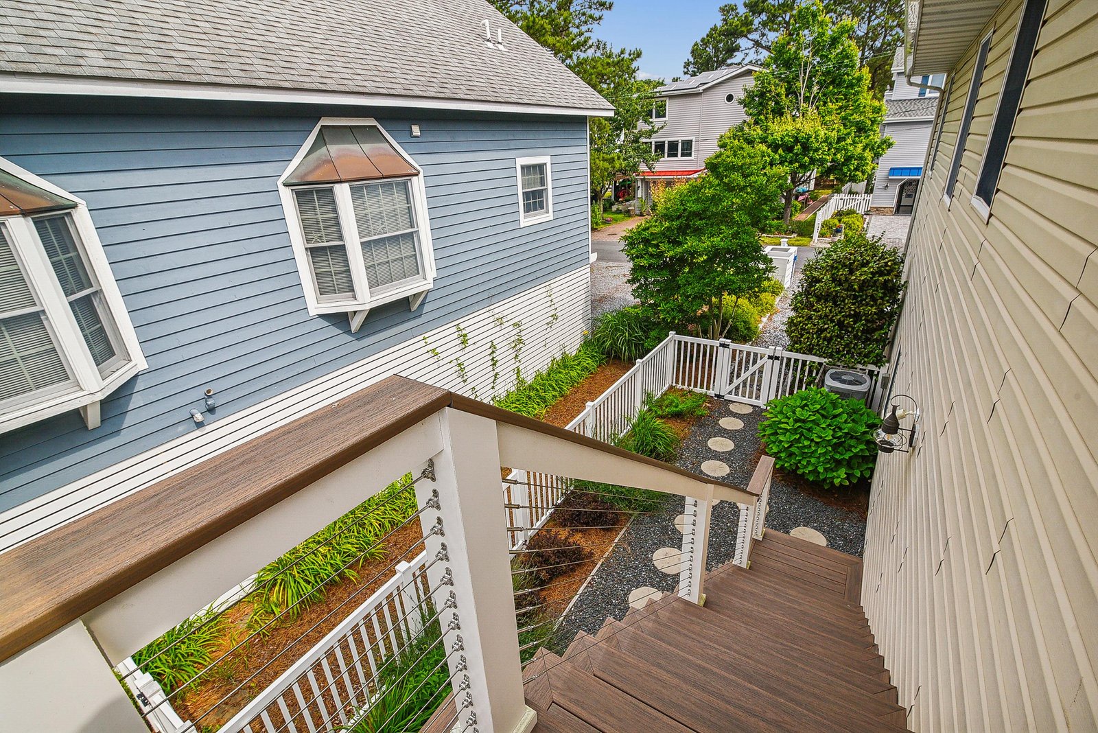 The private deck offers a peaceful spot to enjoy the fresh air and greenery of the surrounding neighborhood.