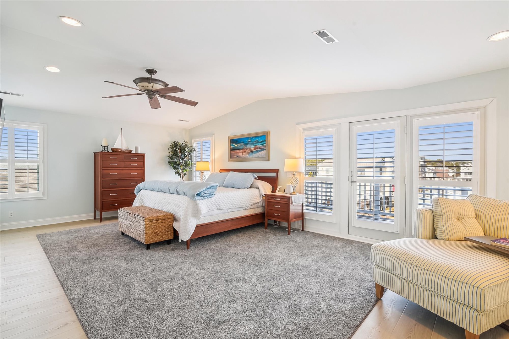 Wake up in your spacious master bedroom with high vaulted ceilings, soft natural light, and a private balcony perfect for morning coffee or evening relaxation.