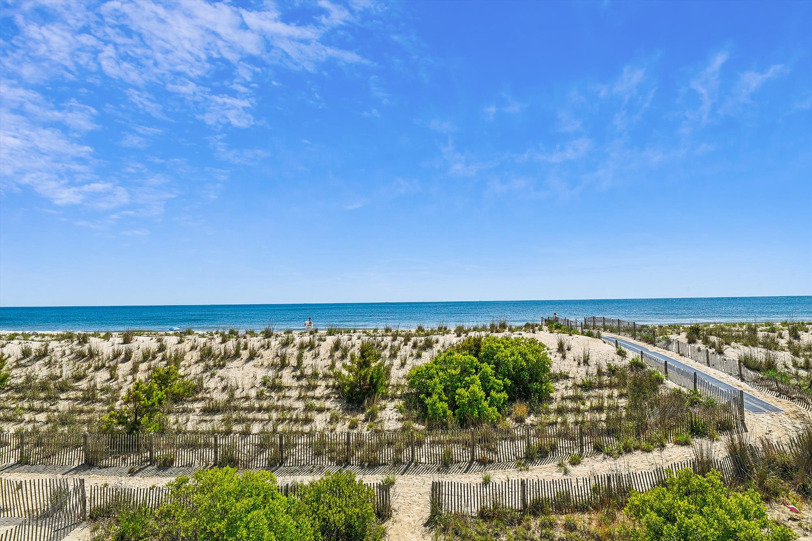 Stunning coastal landscape with pristine beaches and dunes stretching to the horizon, showcasing the natural beauty of the surrounding area.