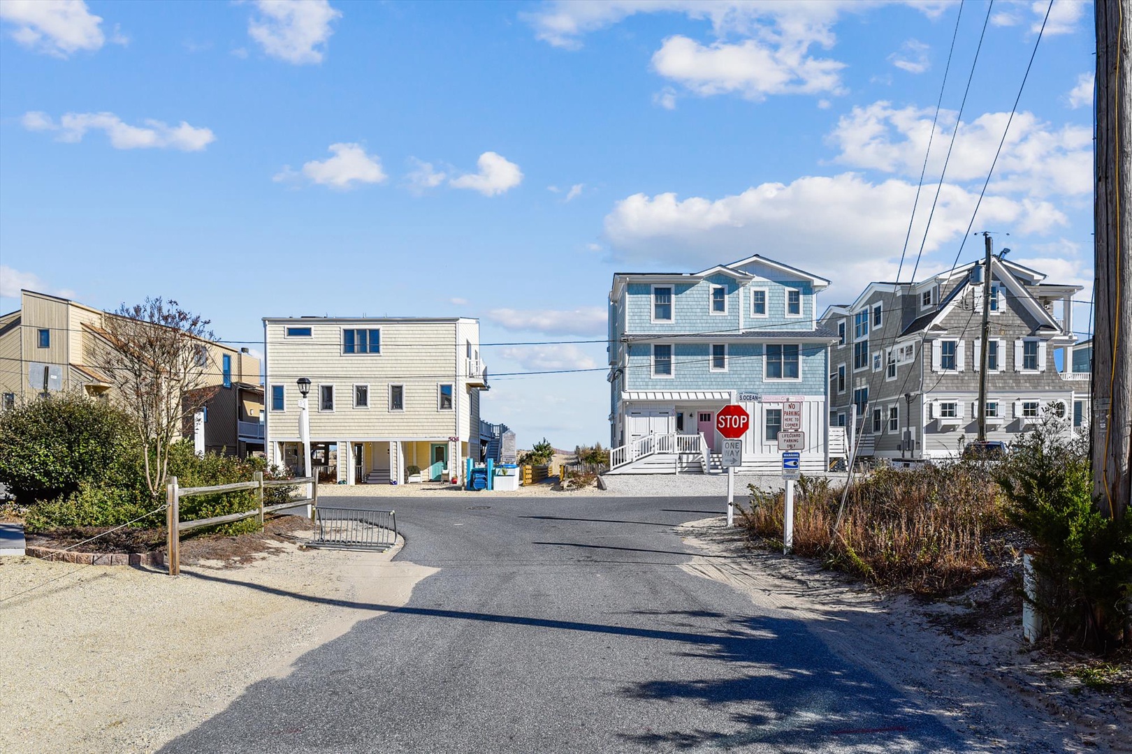 Coastal neighborhood street scene with beach houses and community character near the property.