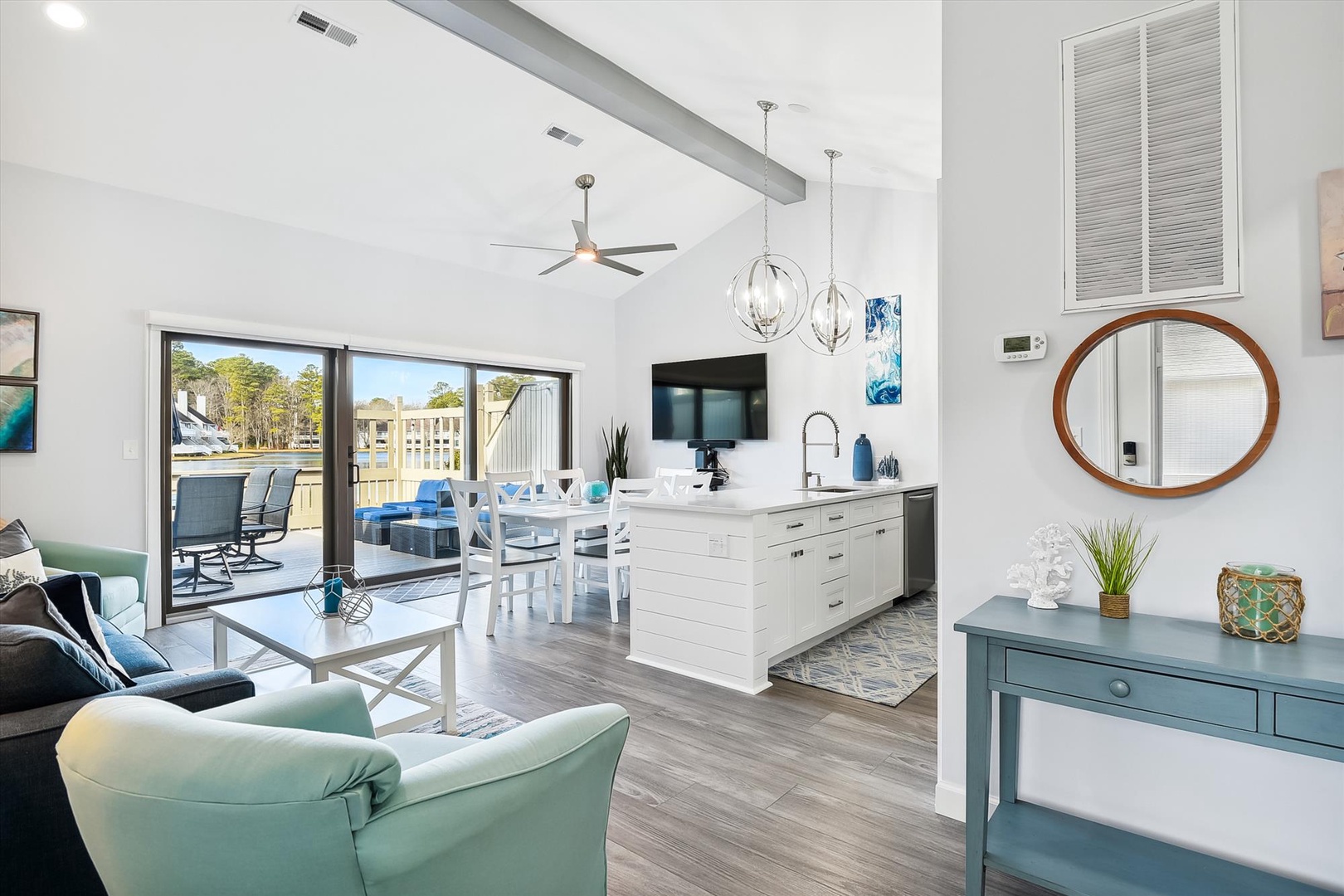 Step into your bright open-concept space where coastal charm meets modern comfort, perfect for relaxing after waterfront adventures.