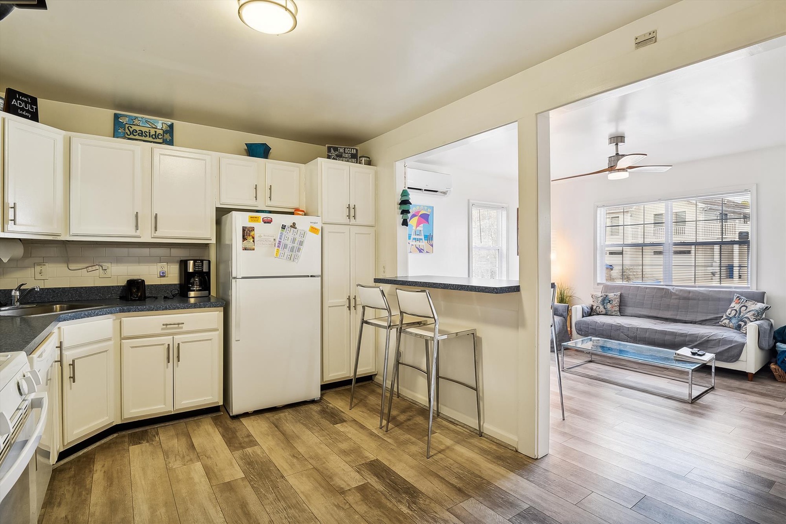 Your fully equipped kitchen flows into a cozy living area, perfect for gathering after beach days or preparing favorite meals in a space that feels like home.