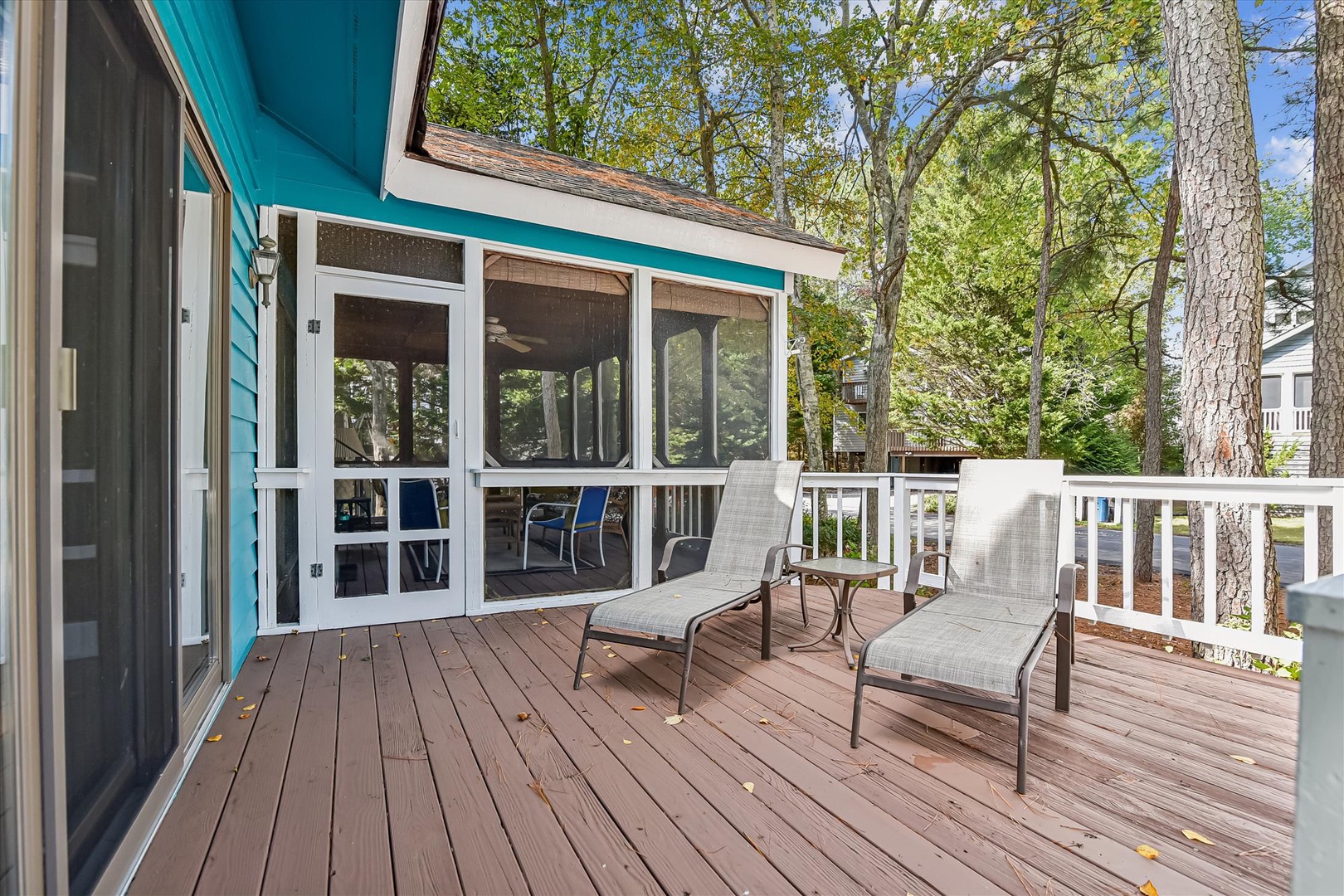 Relax on your private deck with lounge chairs surrounded by mature trees for natural shade and tranquility.
