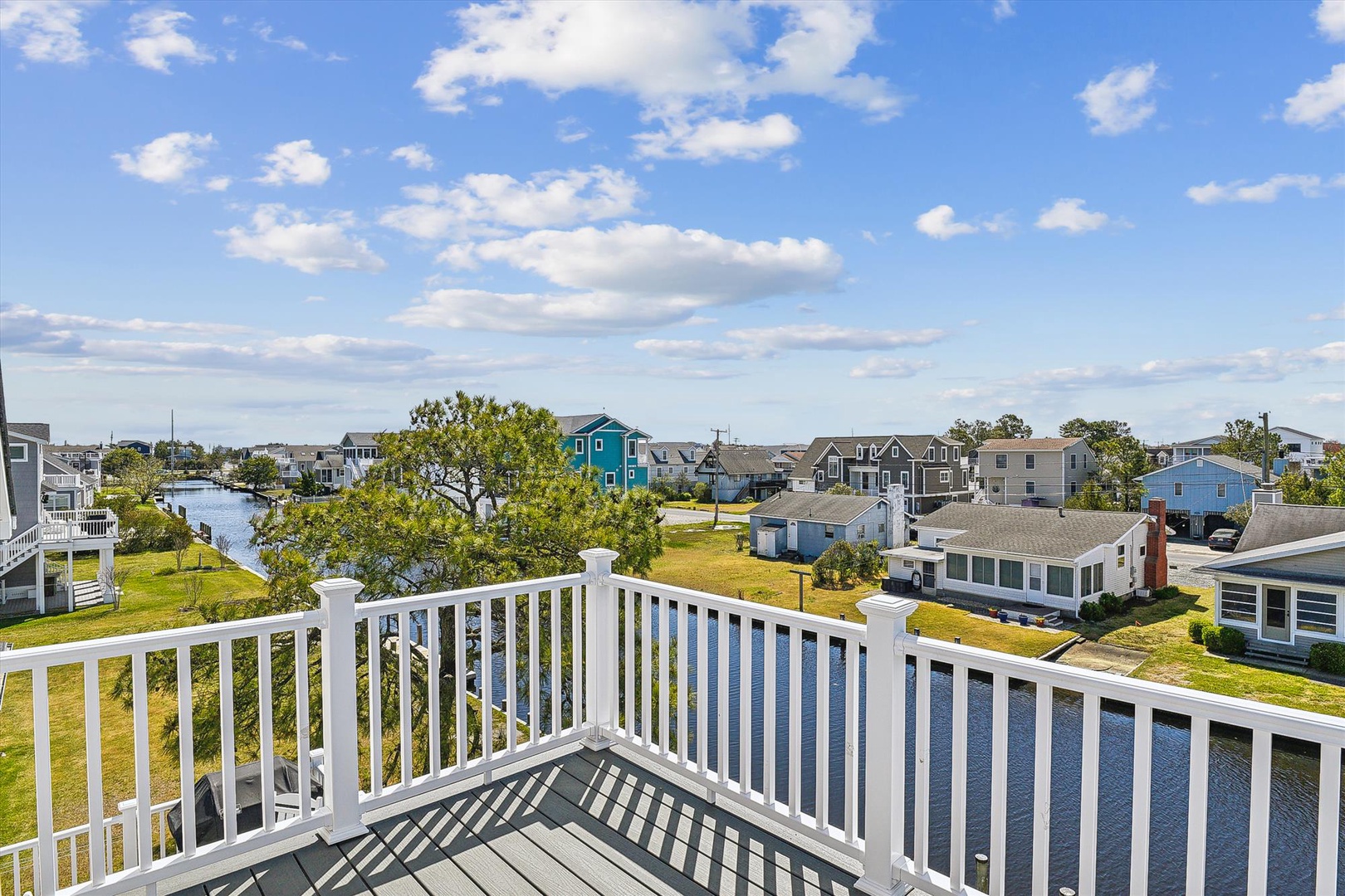 A charming coastal neighborhood with waterfront views and colorful homes, offering a peaceful setting near water access and local charm.