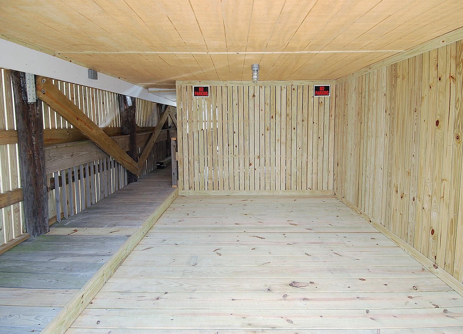 A spacious wooden sauna with natural pine paneling and a slatted viewing window—your perfect spot to unwind and recharge after a day of exploration.