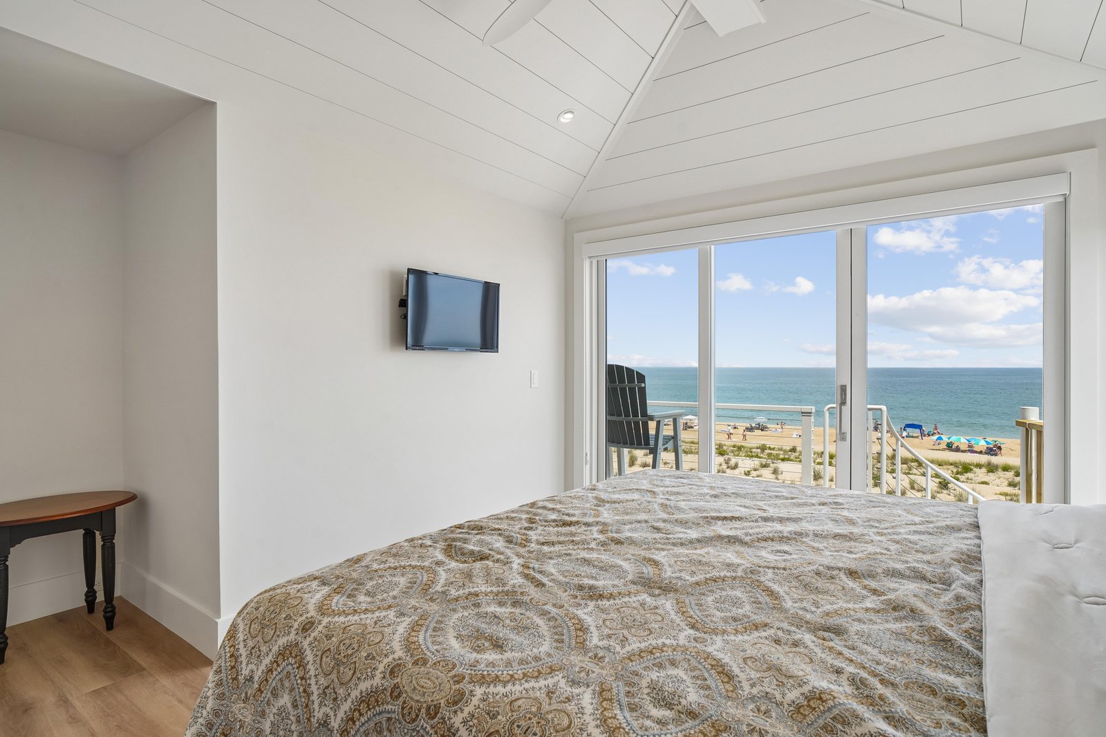 Wake up to stunning ocean views through your private balcony doors. Soft coastal light fills the bright, serene bedroom, where you can drift off to the sound of waves and sunshine.