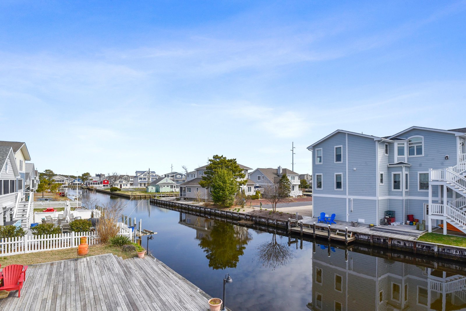 This picturesque waterfront community offers tranquil canal views framed by charming coastal homes and private docks—a peaceful backdrop for your seaside getaway.
