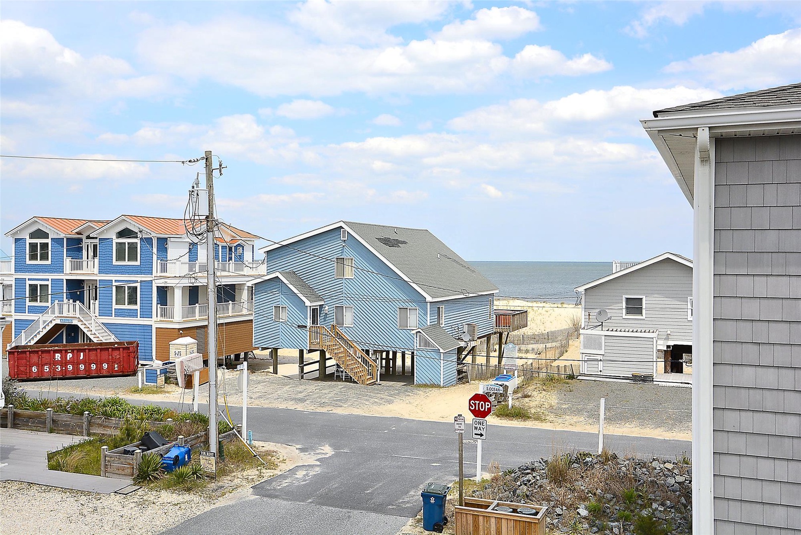 Coastal neighborhood just steps from the beach, with convenient beach access and scenic views of the ocean beyond the surrounding homes.