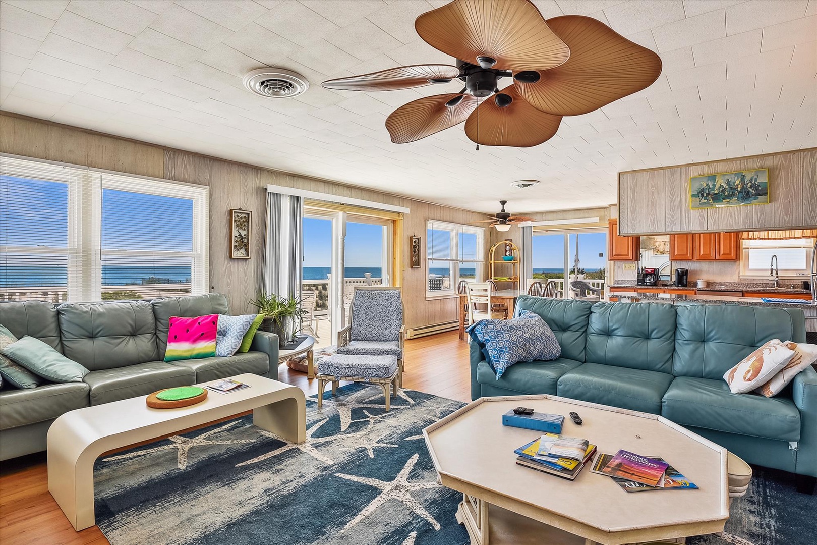 Sink into plush sofas with your favorite book or simply gaze at the stunning oceanfront panorama. The coastal breeze drifts in as ceiling fans hum overhead, keeping you cool and comfortable.