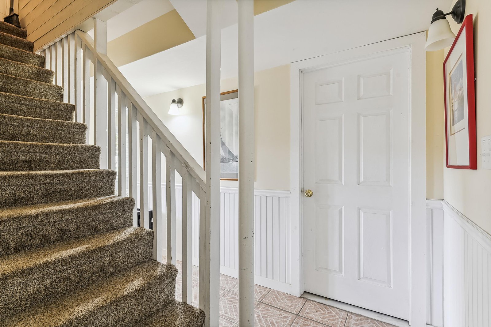 Step inside your bright, welcoming entryway where natural light and classic coastal details invite you to settle in and unwind.