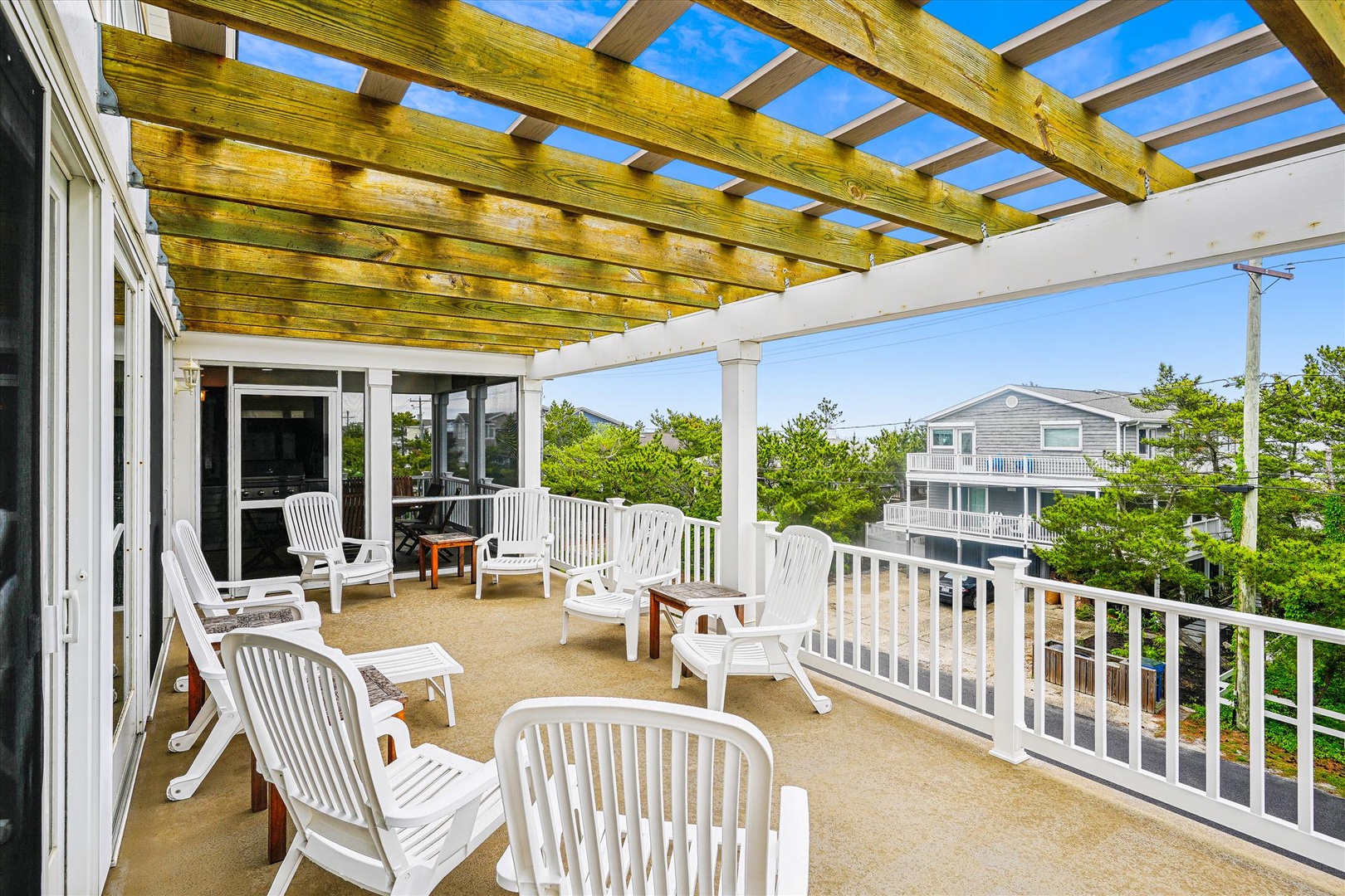 Step onto your private deck and settle into a lounge chair beneath the pergola. Soak in the sunshine, feel the coastal breeze, and let the peaceful neighborhood views set the tone for your beach escape.