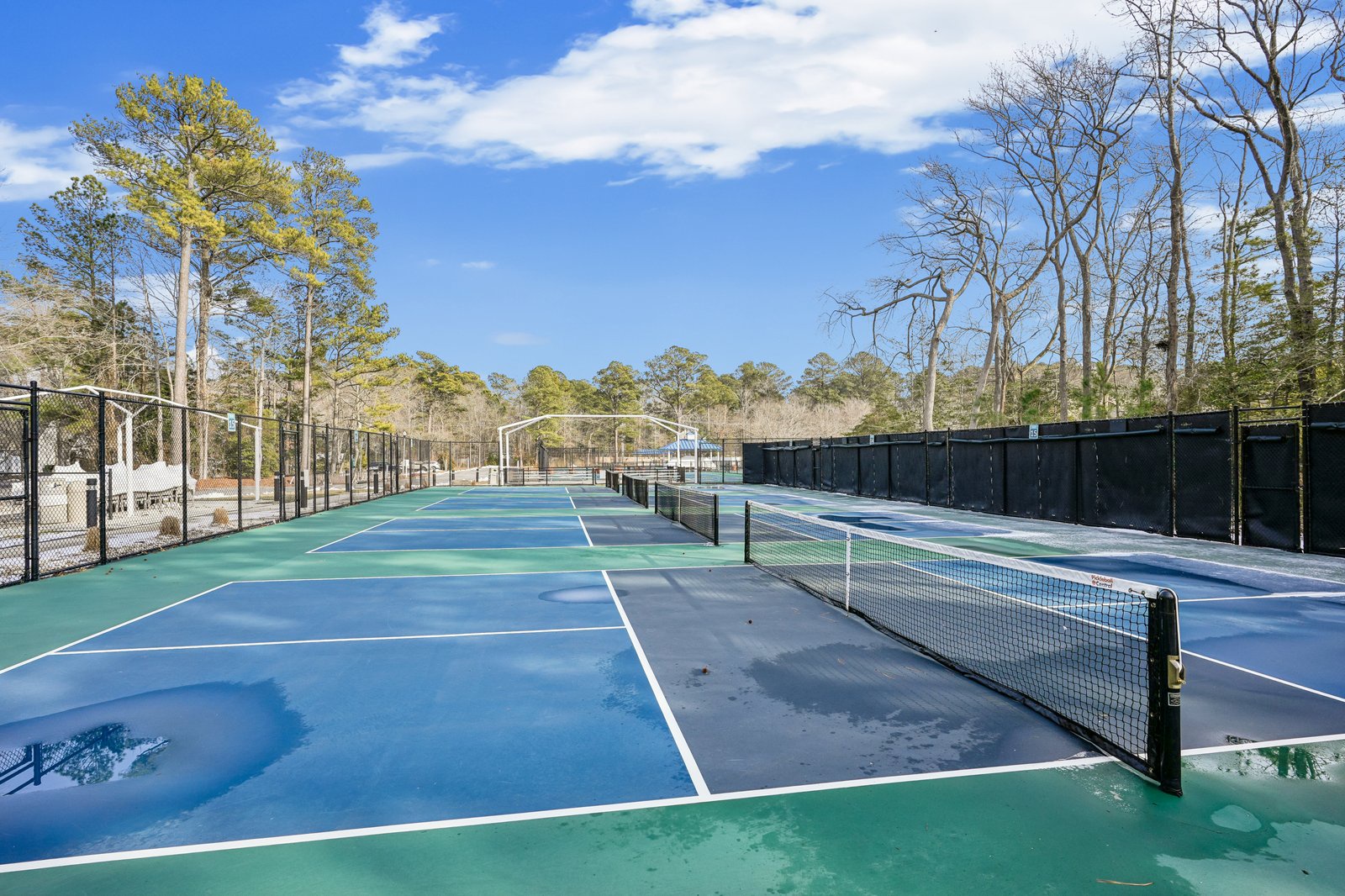 Challenge friends to a match on your private tennis court, surrounded by peaceful trees and open skies for the perfect outdoor game.