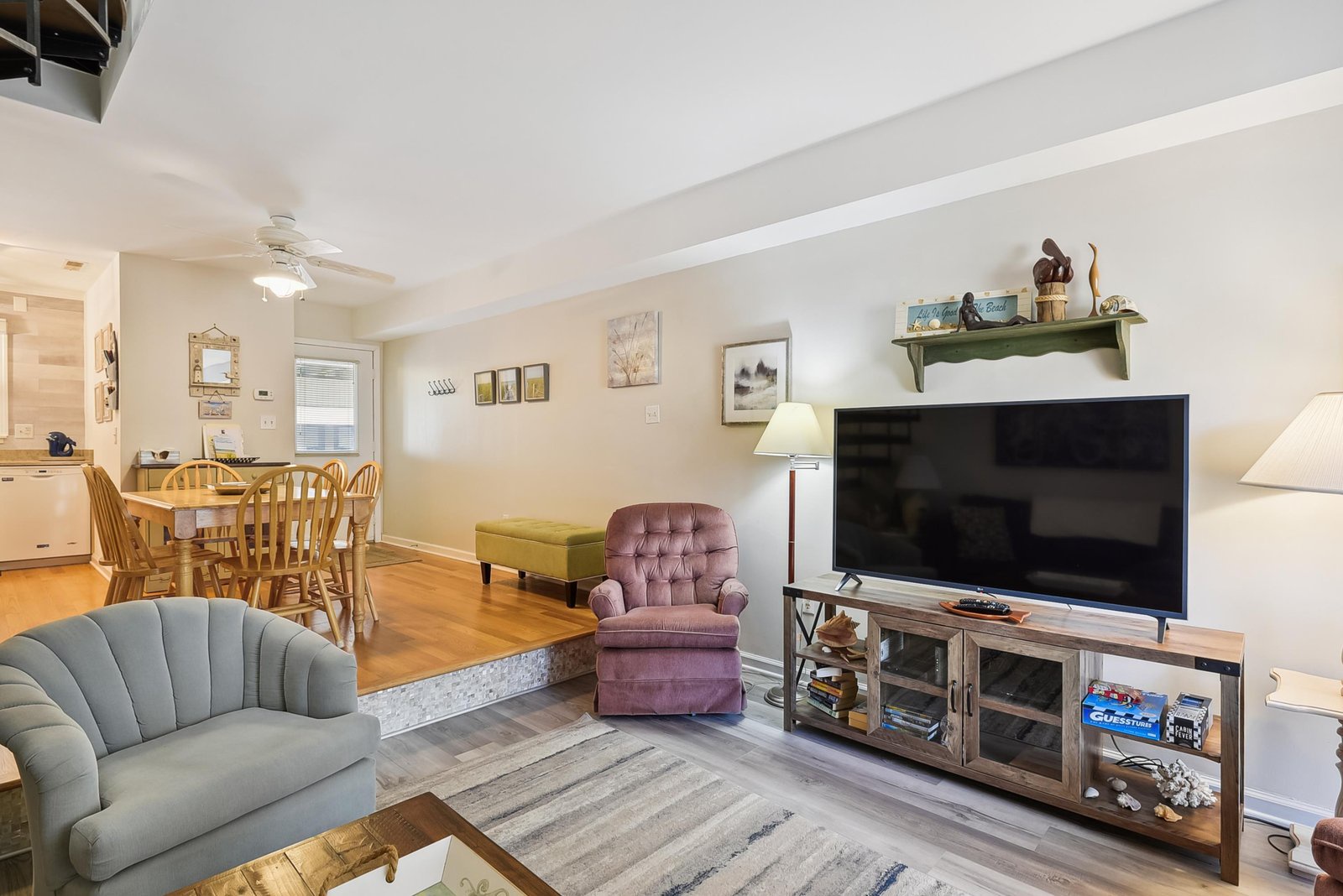 Unwind in your spacious open living area, where cozy seating, warm wood tones, and thoughtful touches create the perfect retreat after exploring the coast.
