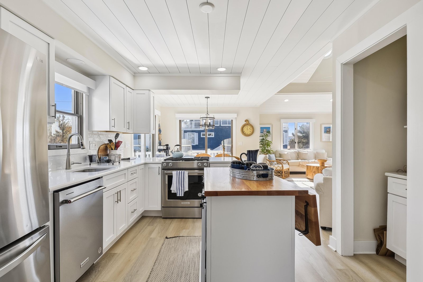 Bright, open kitchen with a farmhouse island and natural light pouring in—ready for your morning coffee or family meals together.