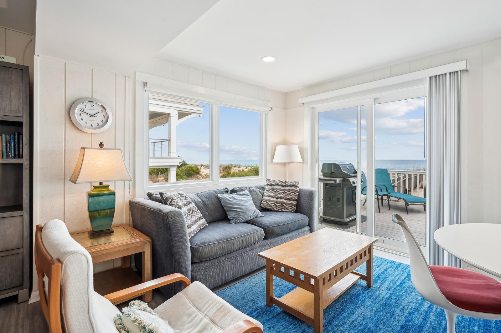 Step into your bright coastal retreat and let the ocean views greet you through expansive windows. Sink into the comfortable seating, feel the sea breeze drift in, and unwind in this light-filled space designed for your perfect beach getaway.